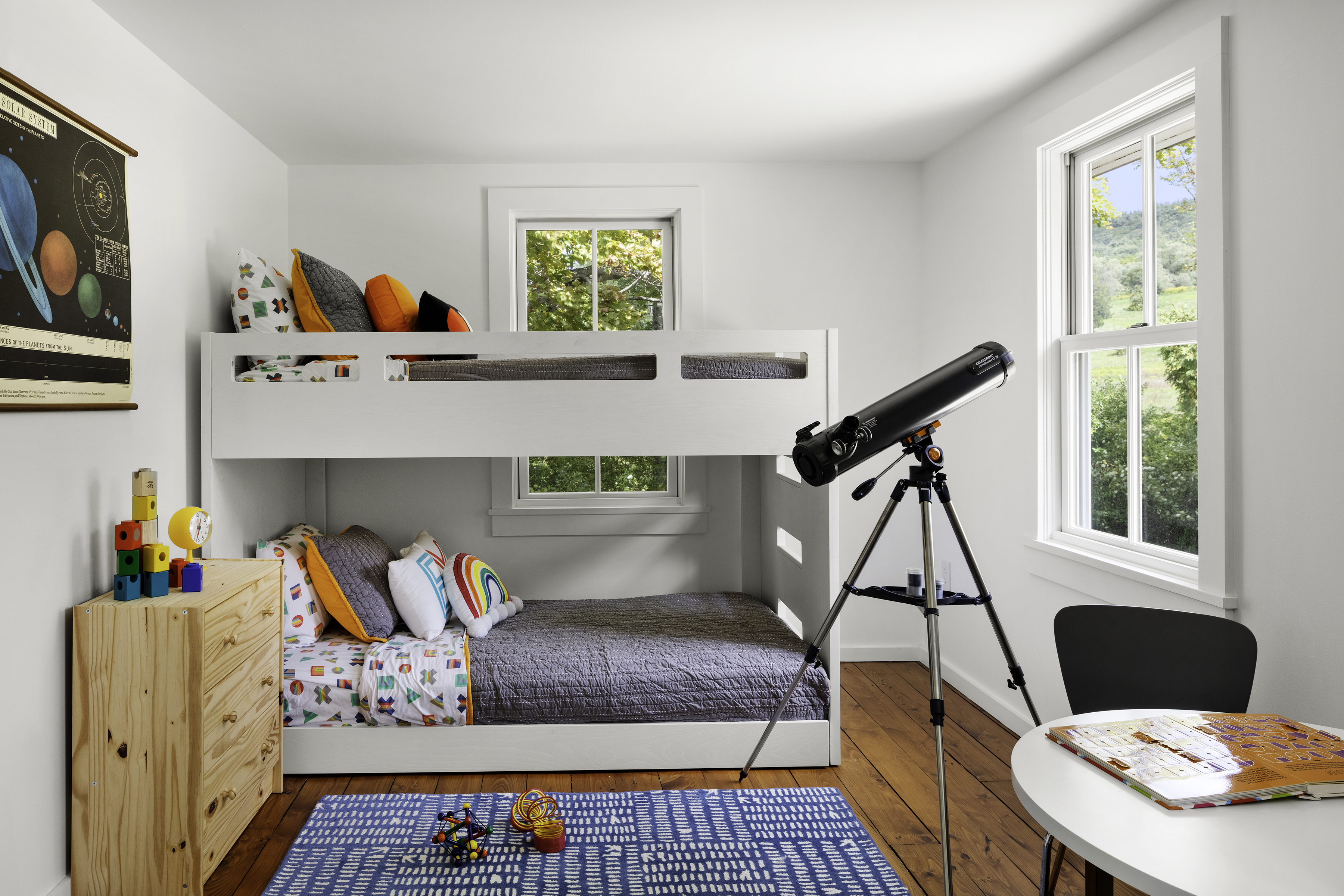 For their son’s room, the owners chose a scaled down bunk bed from Crate&Kids and a shallow, unfinished pine dresser from Ikea.