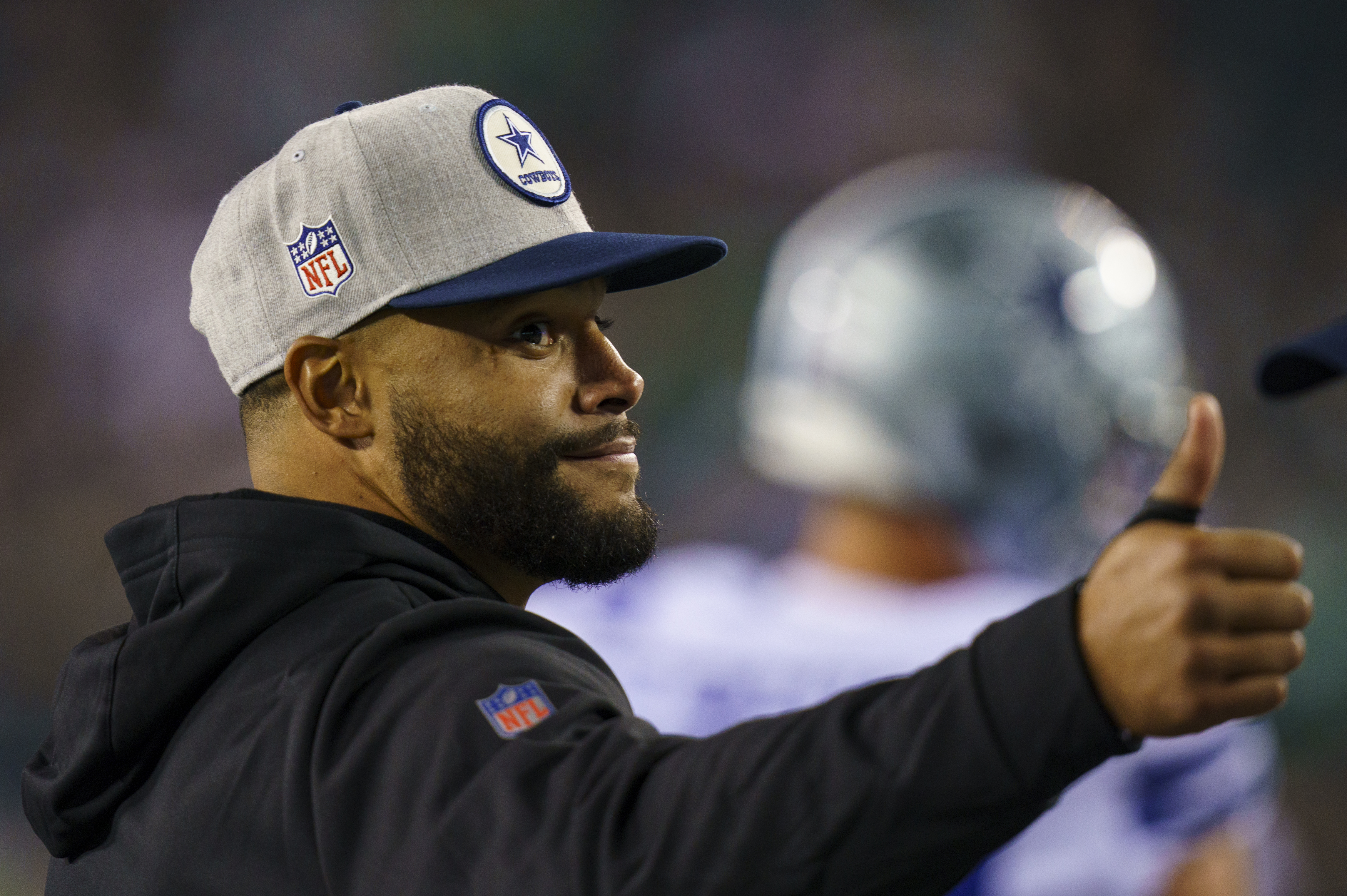 Dallas Cowboys quarterback Dak Prescott wears a Crucial Catch hat