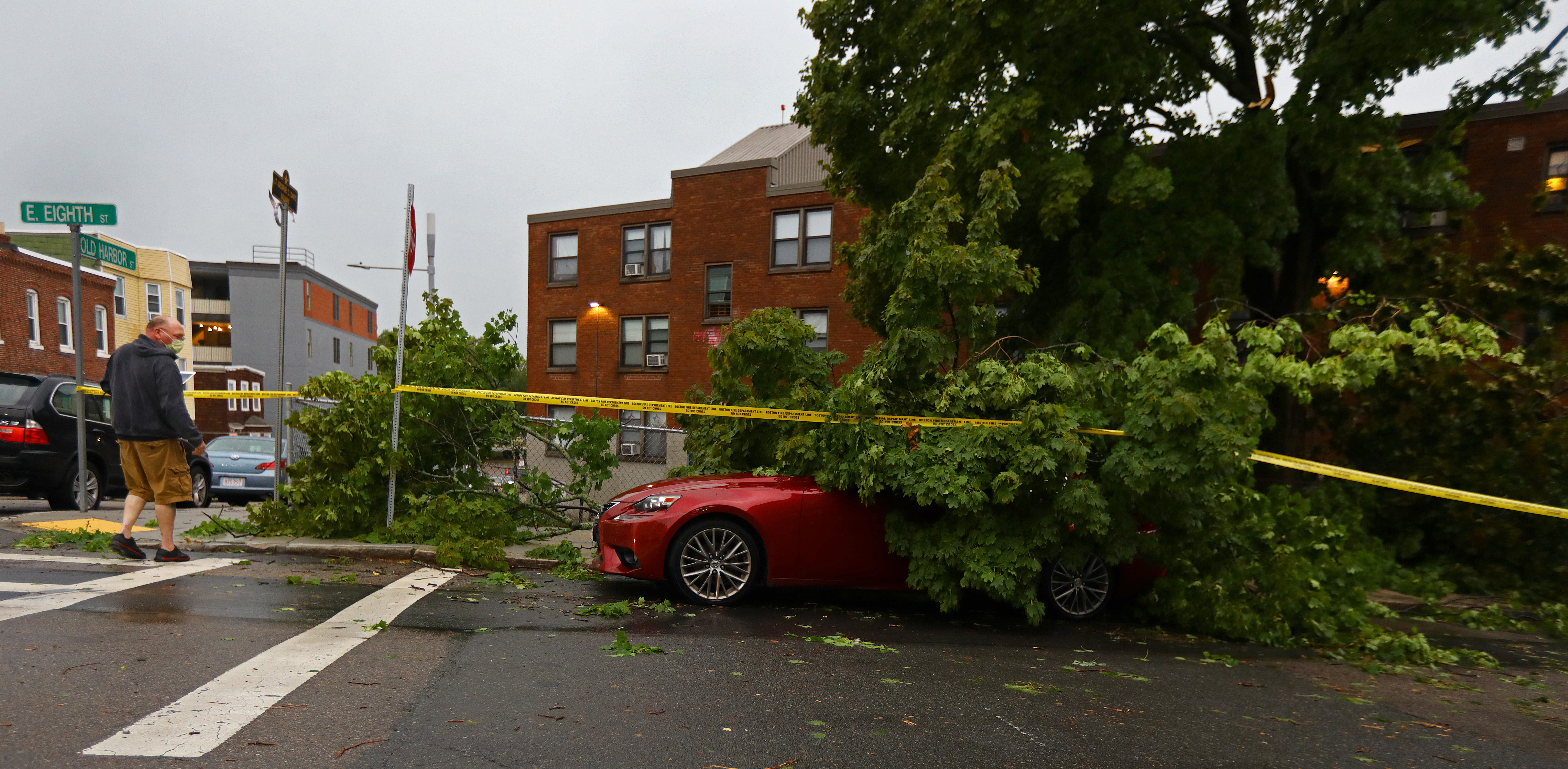 A storm rolled through Boston and five cars were damaged when lightning brought down tree branches at East Eighth and Old Harbor streets.