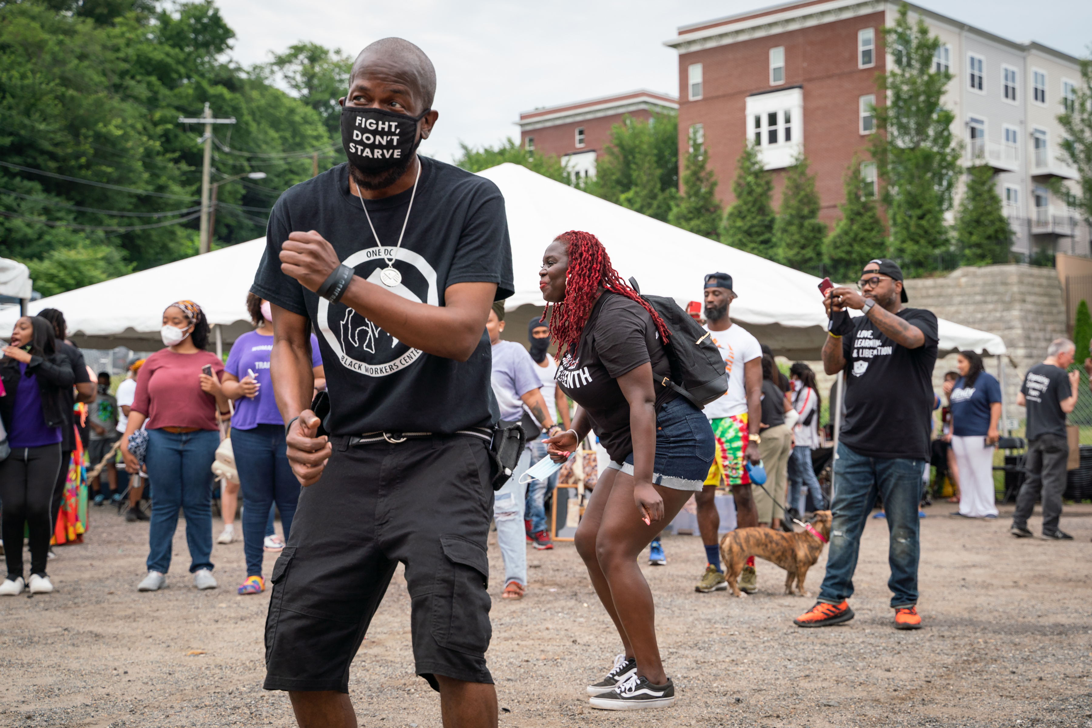 People dance during a performance by Ambition Band at a Juneteenth celebration and reopening party at the ONE DC Black Workers & Wellness Center in Washington, on Saturday.