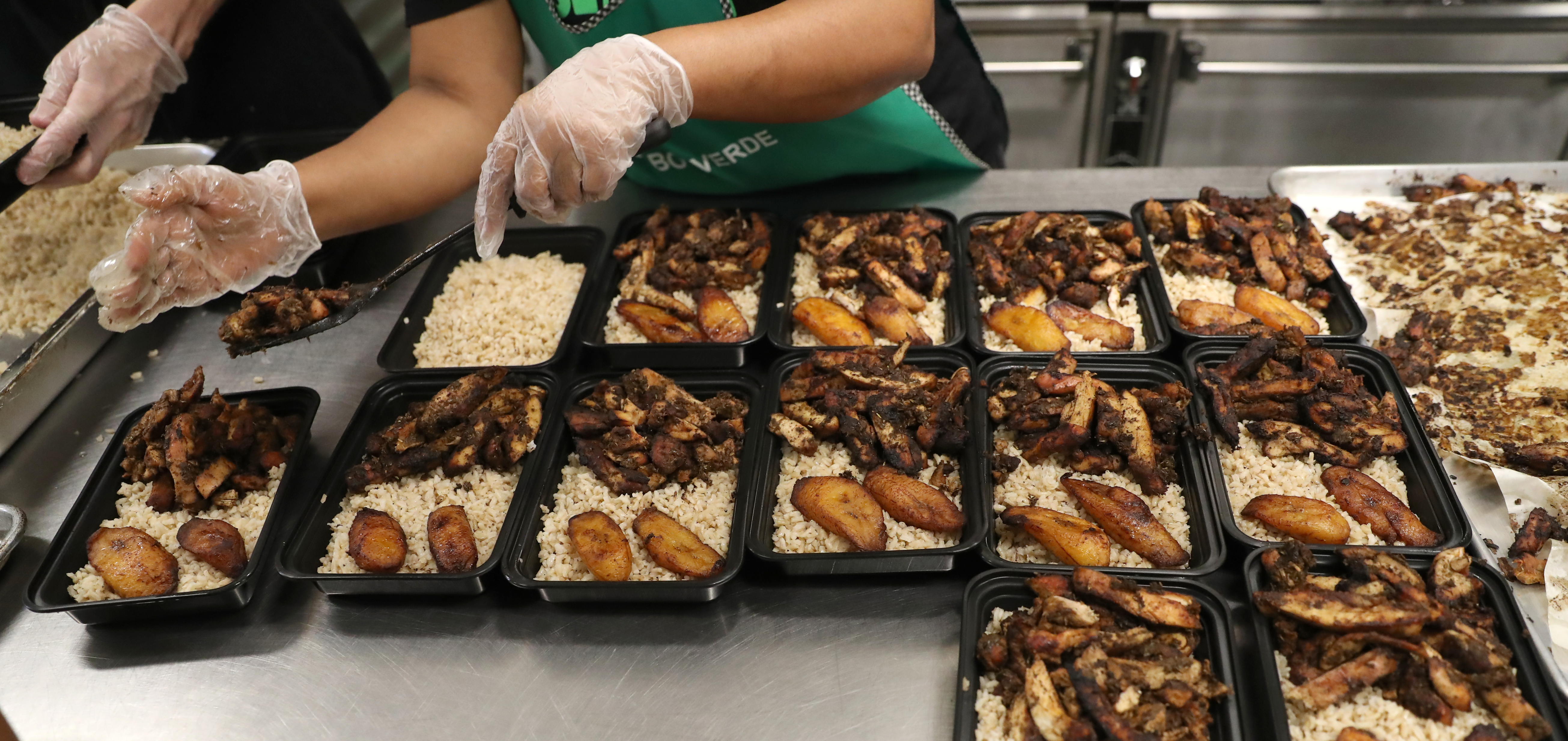 Workers with Fresh Food Generation prepared meals for delivery to Boston offices.