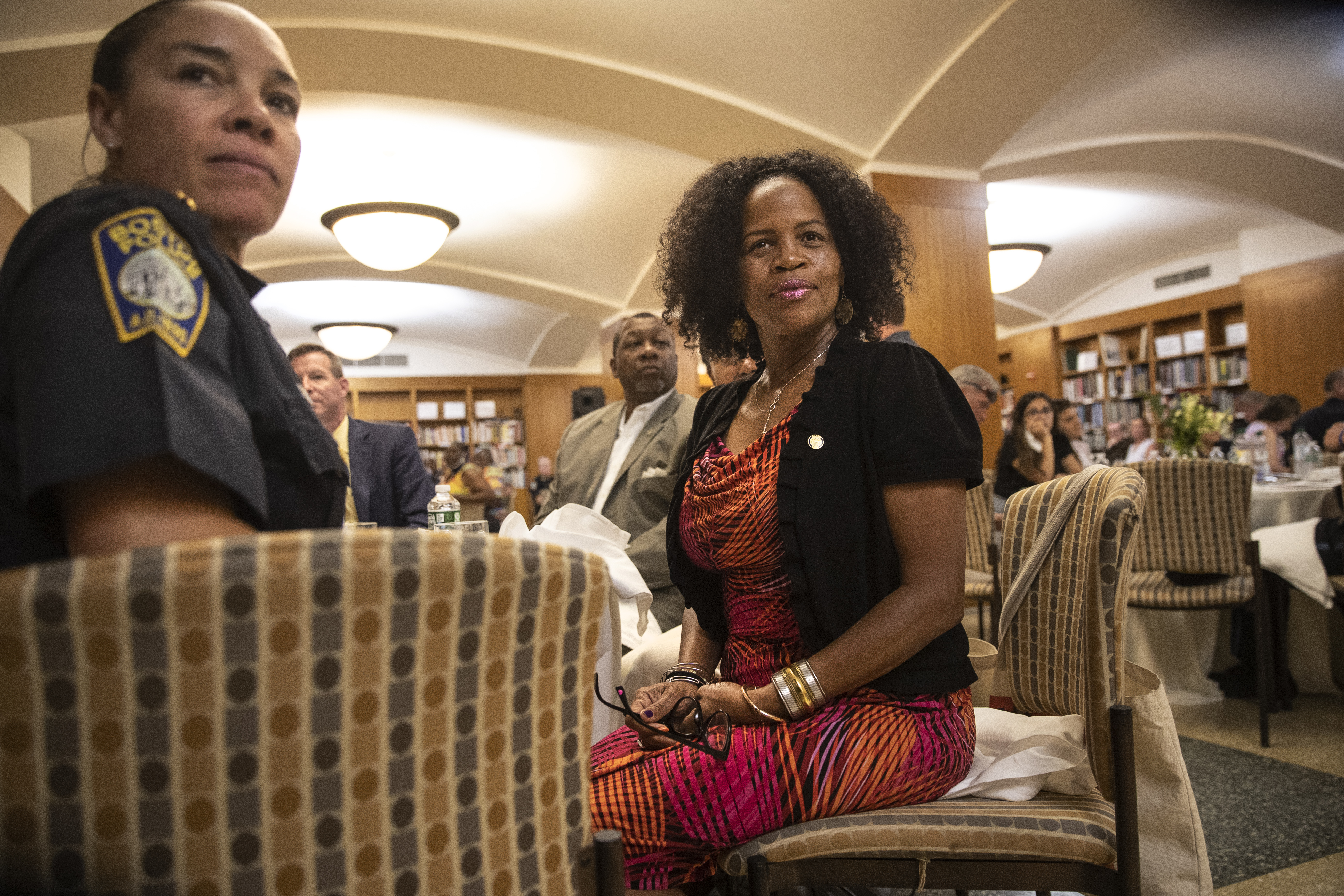 Superintendent Nora Baston, left, sits with Boston Mayor Kim Janey during the Boston Police Department's 38th Annual National Night Out Luncheon at the Boston Public Library.