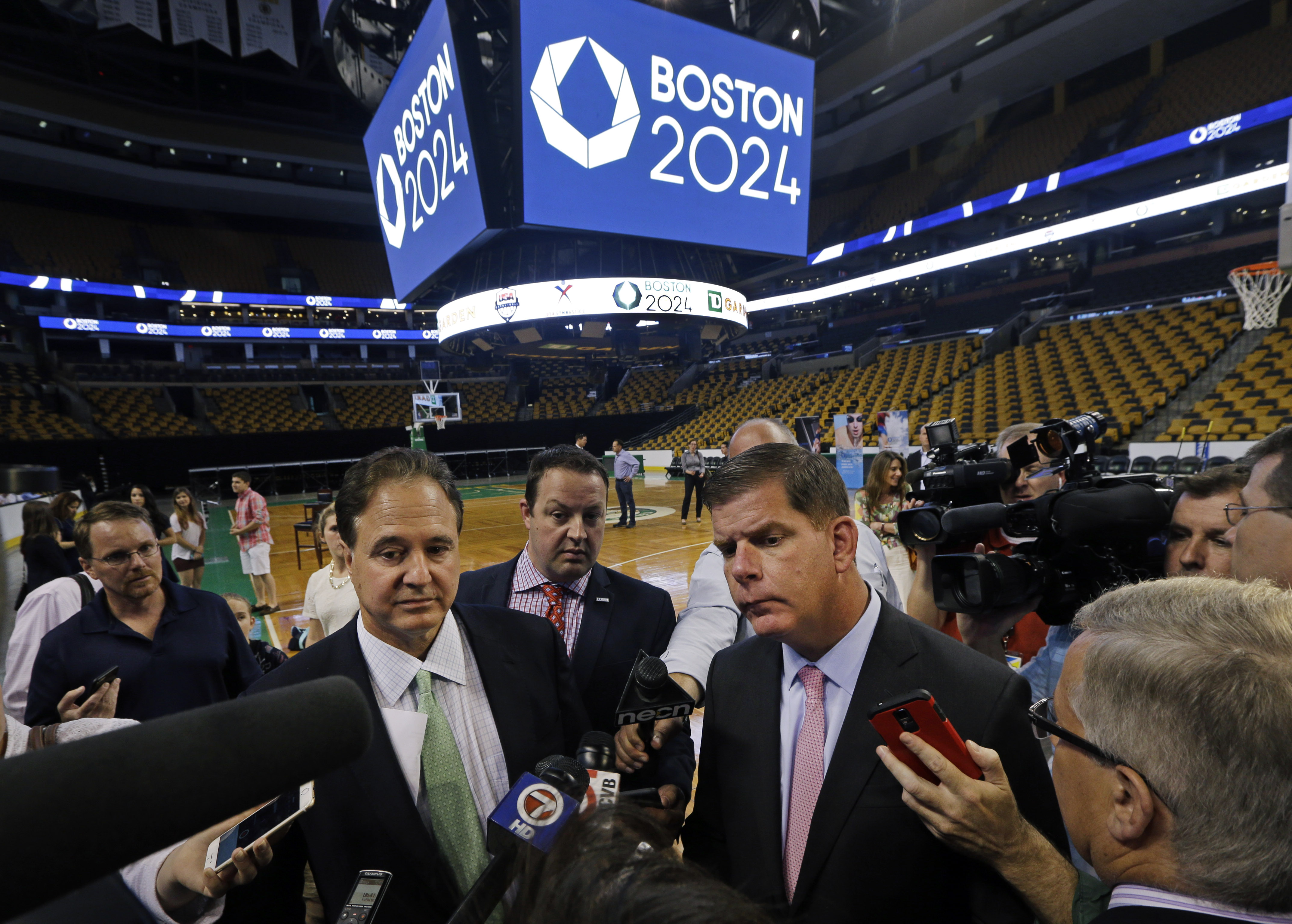 Mayor Walsh and Steve Pagliuca (foreground left), who had a leading role in the effort to bring the Summer Olympics to Boston, announced the TD Garden would be the site of the Olympic and Paralympic basketball finals and Olympic gymnastics and trampoline if the city won its bid to host the games.