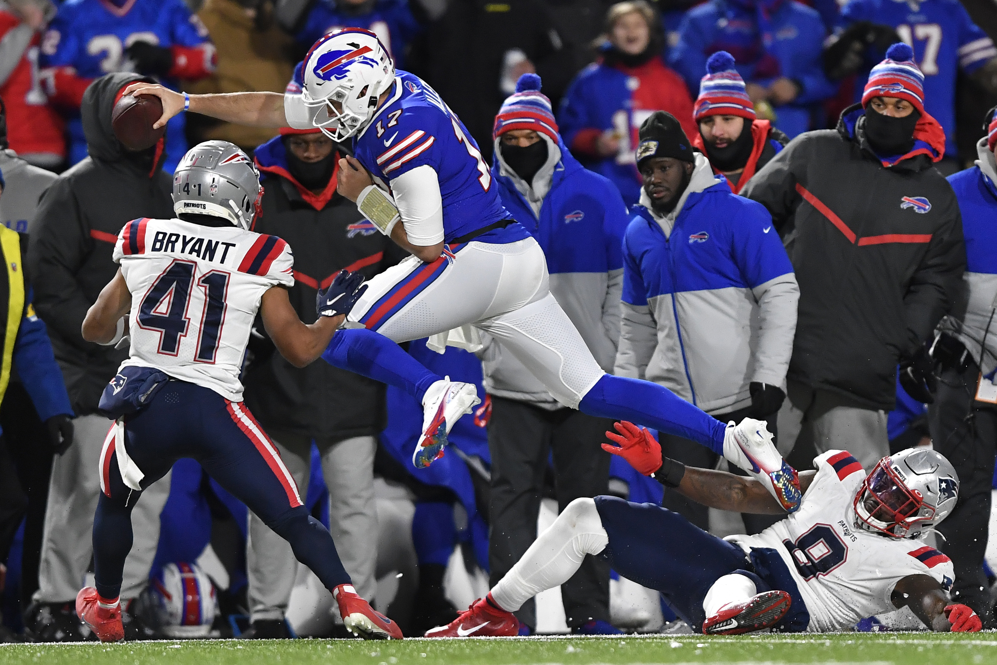 Bills quarterback Josh Allen (17) reaches for a first down as he is forced out of bounds by cornerback Myles Bryant.