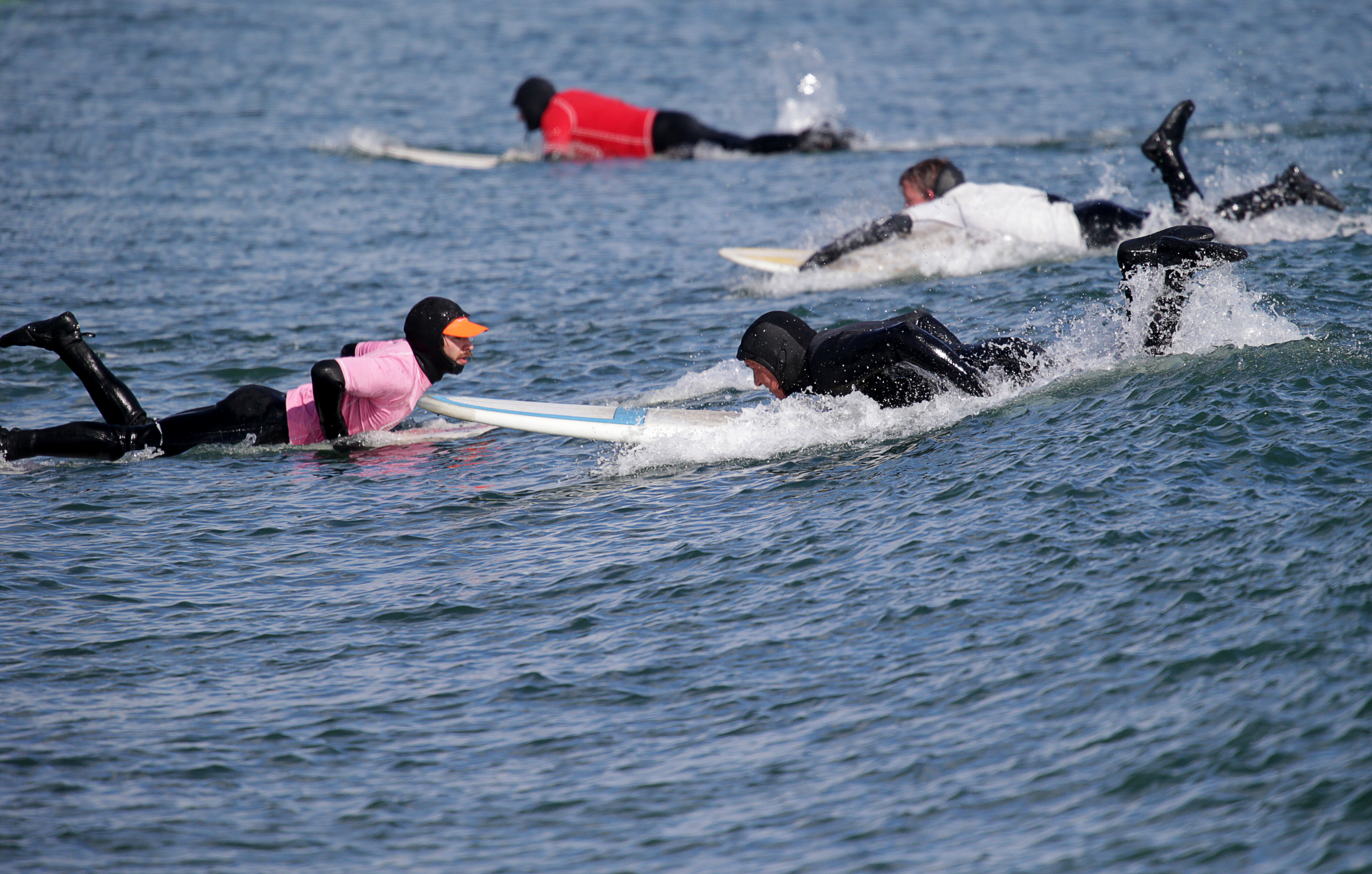 Surfers in the water during the competition.