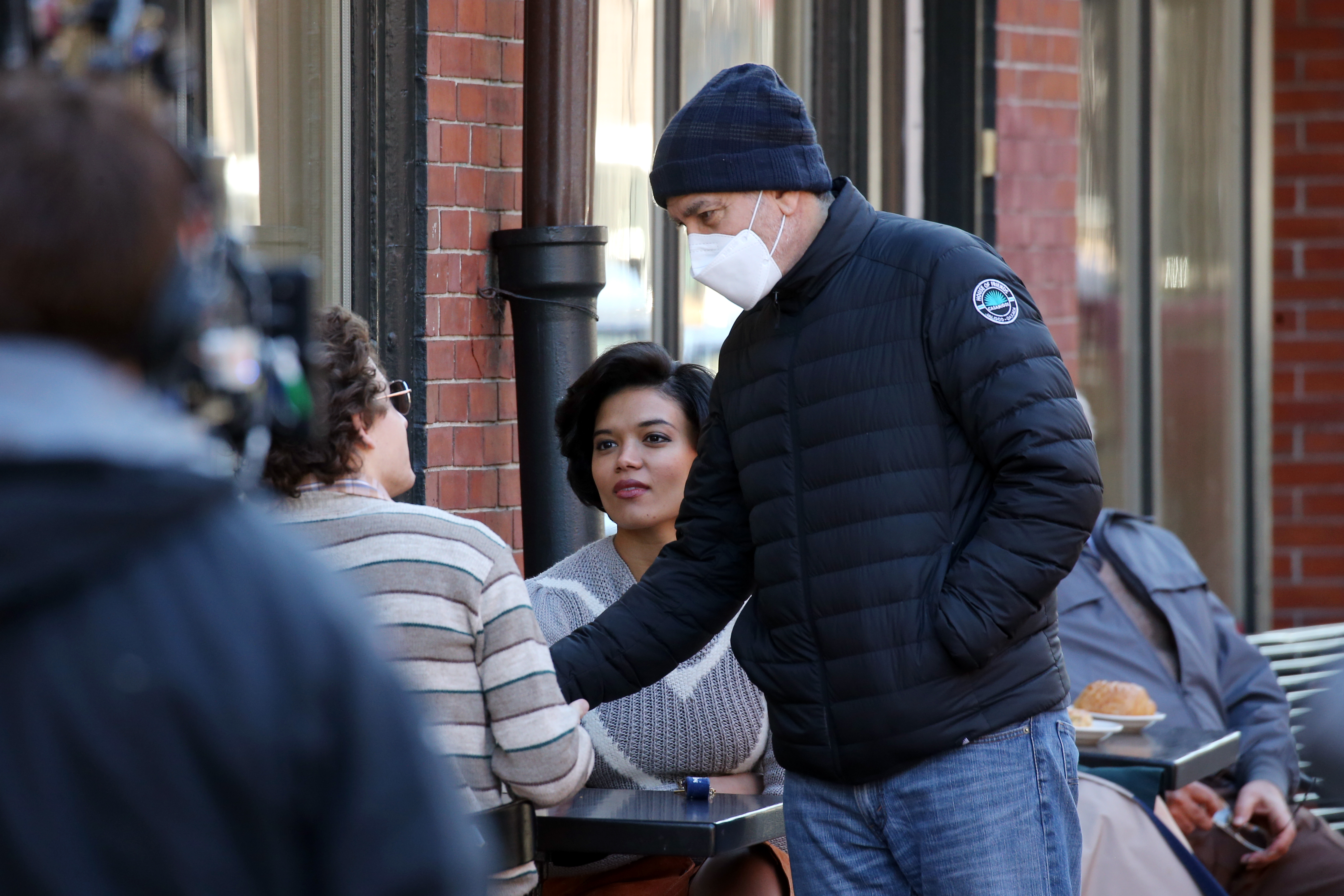 Director George Clooney (right) talked with actor Tye Sheridan (left) who was seated across from actress Briana Middleton.