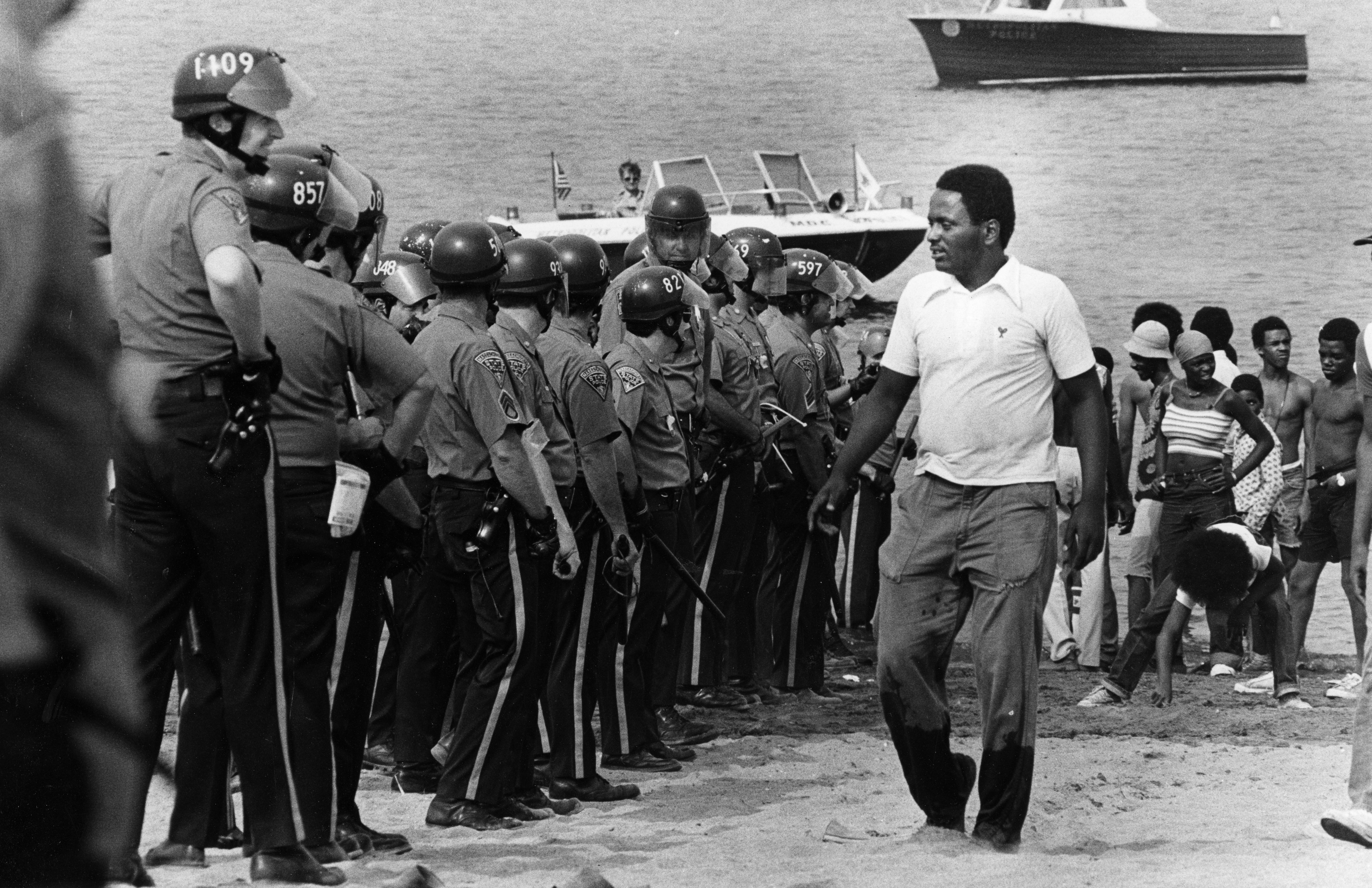 State Police formed a human wall to keep people back during a demonstration at Carson Beach in Boston pn Aug. 10, 1975.