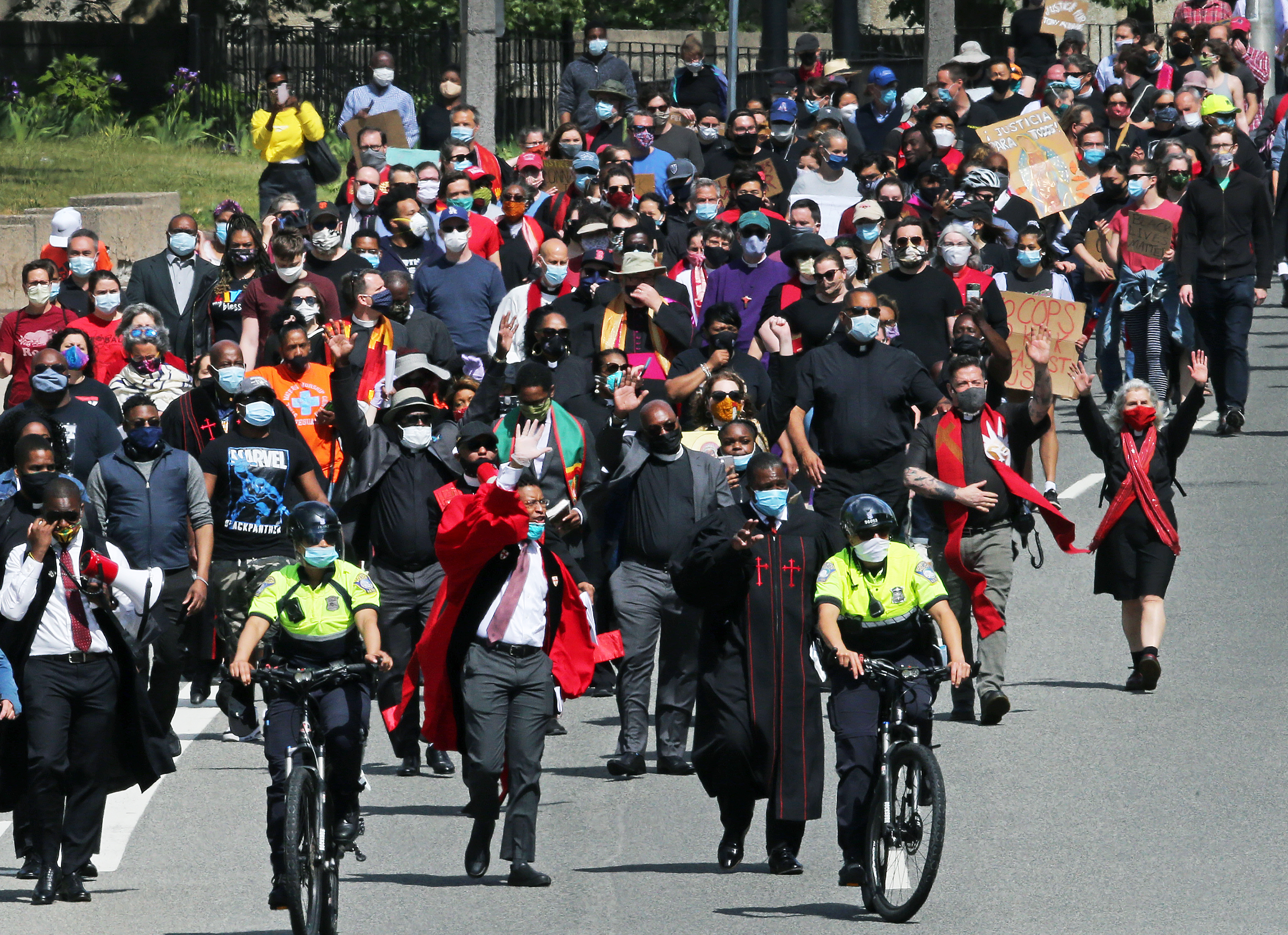 A large group of protesters are pictured as they marched from Nubian Square on Malcolm X Boulevard towards Boston Police Headquarters on Sunday