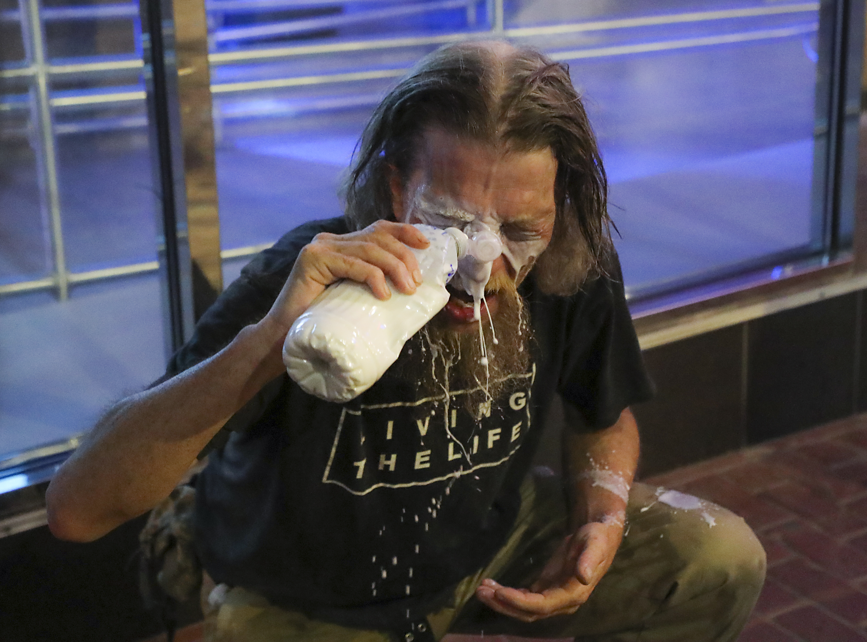 An unidentified man poured milk on his eyes after he was sprayed with pepper spray in Downtown Crossing.