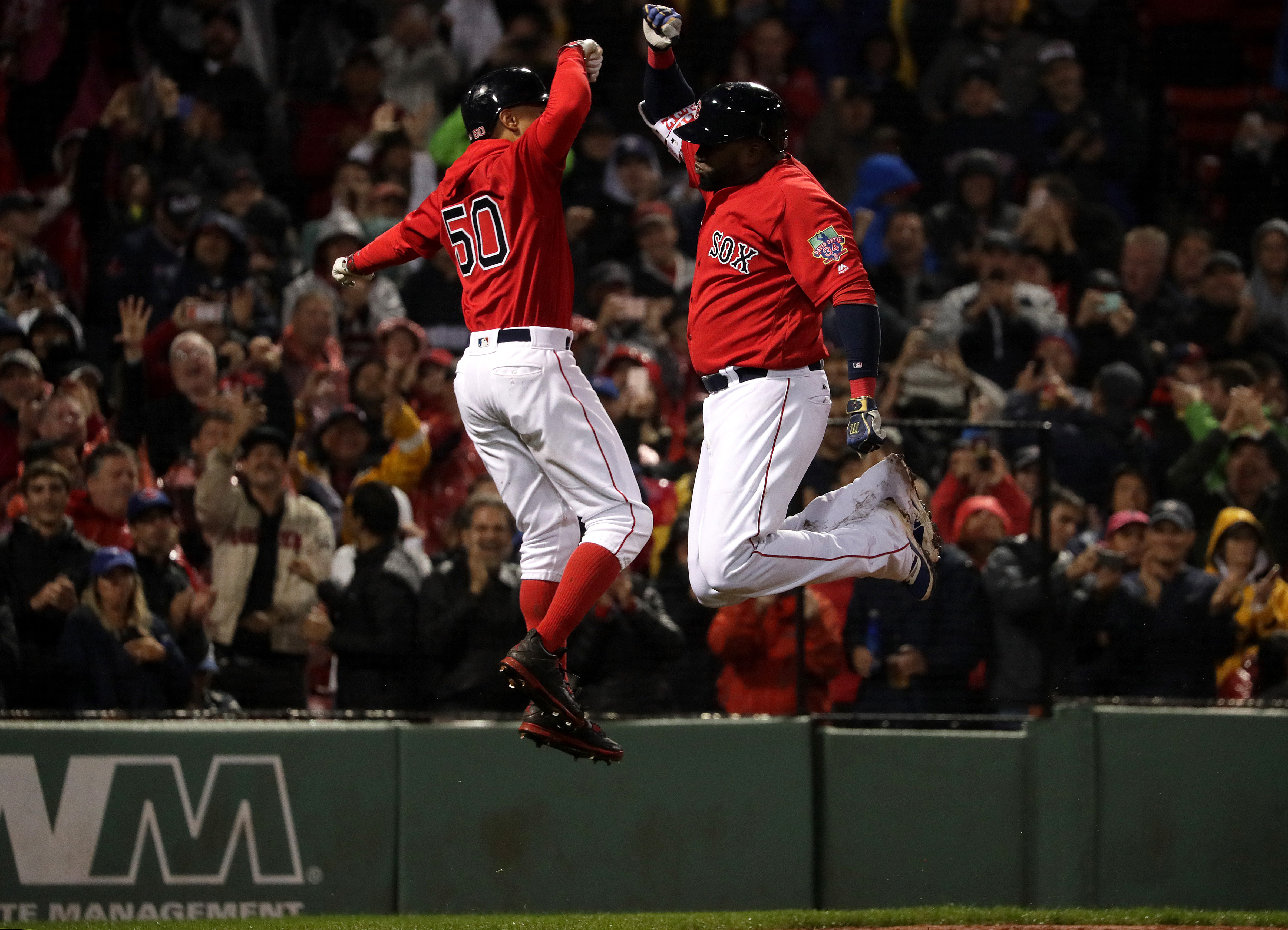 Ortiz celebrates his final home run with Mookie Betts during a Sept. 30 game against the Jays.