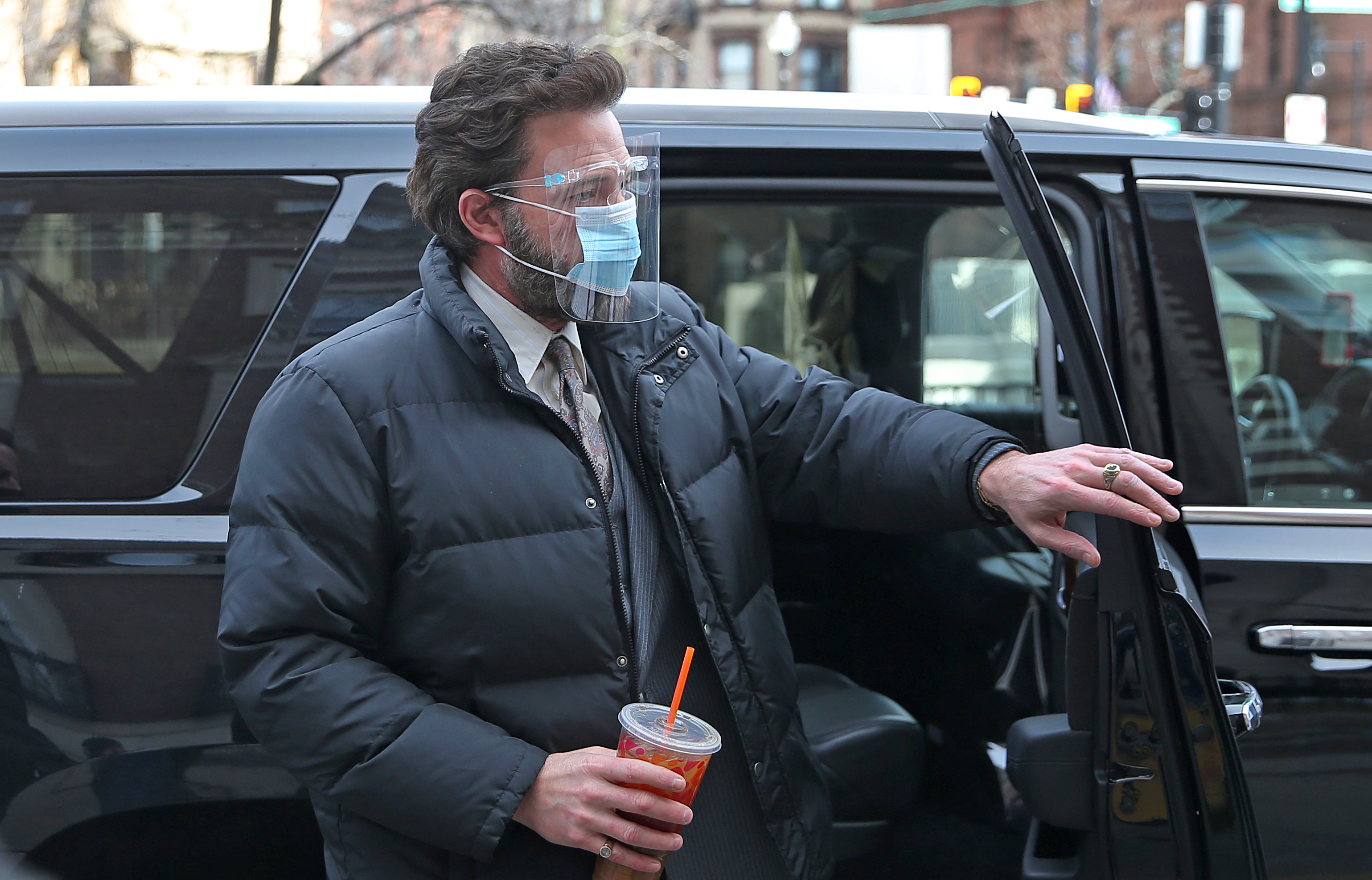 Ben Affleck arrives with Dunkin' iced coffee in hand for "The Tender Bar" filming Friday morning in the Back Bay.