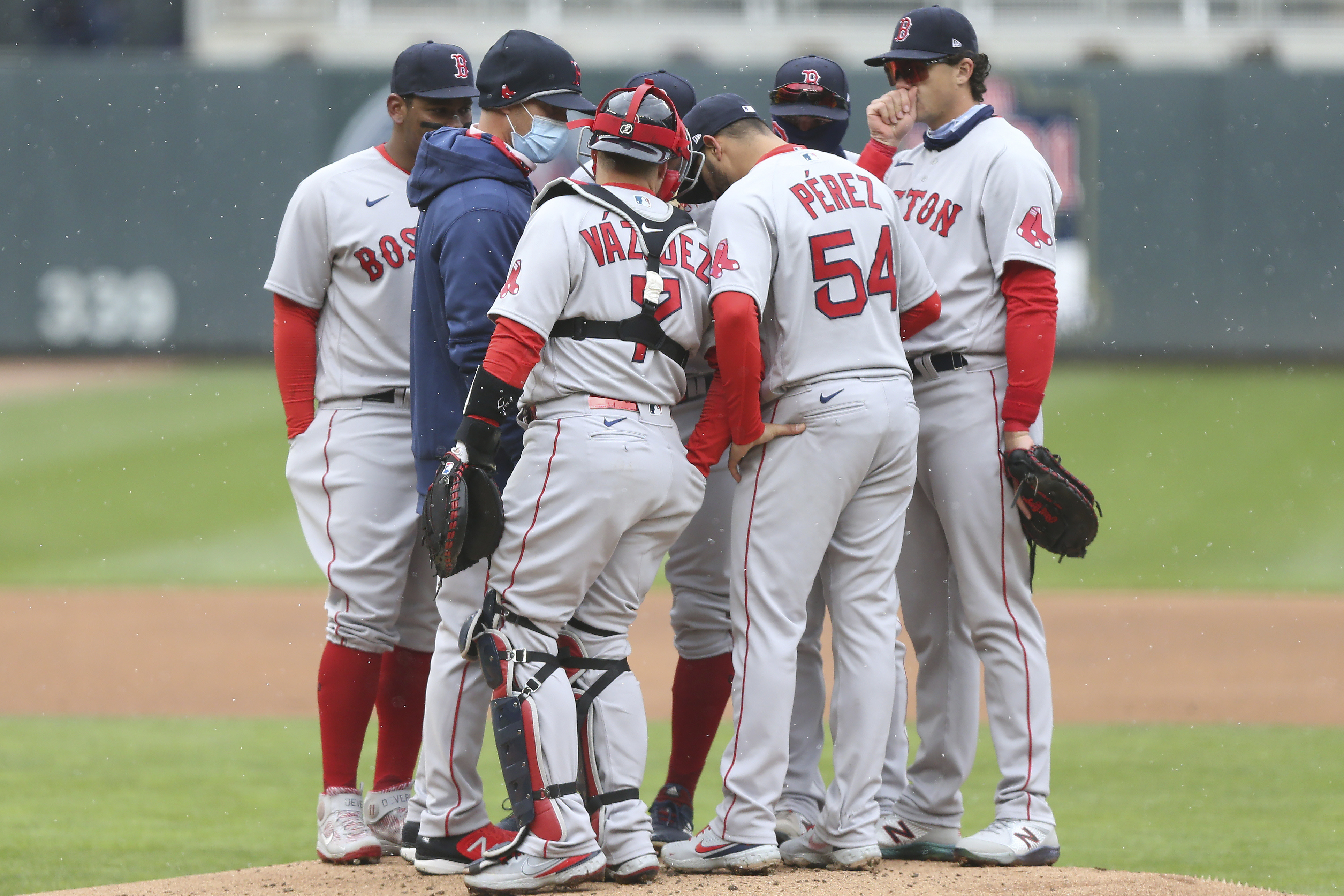 The Red Sox meet on the mound during the first inning of Tuesday's game.