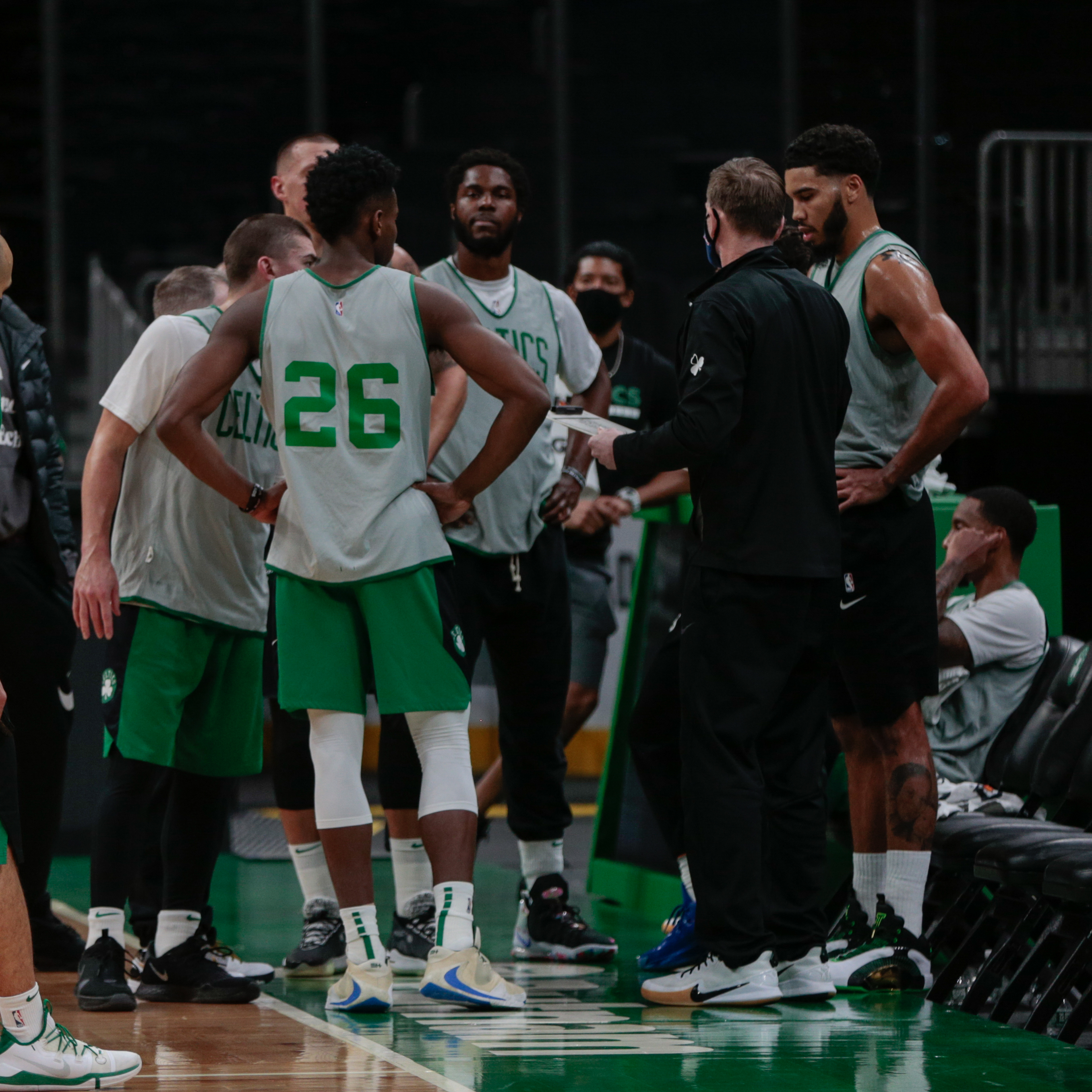 Celtics players huddled during practice on Wednesday at an empty TD Garden.