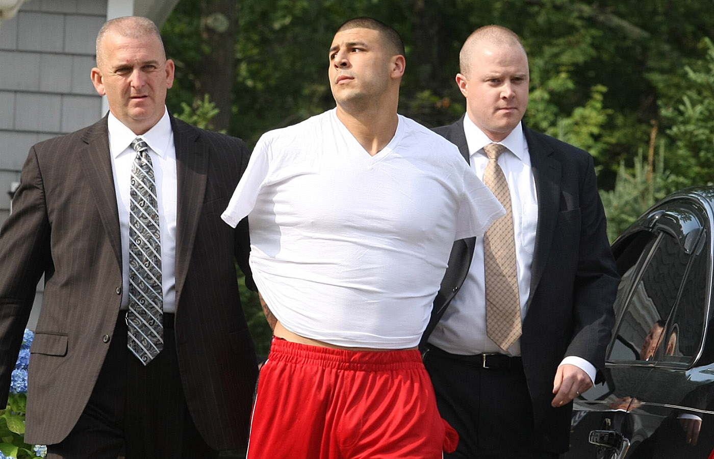 Tight end Aaron Hernandez is arrested on a murder charge on June 26, 2013.