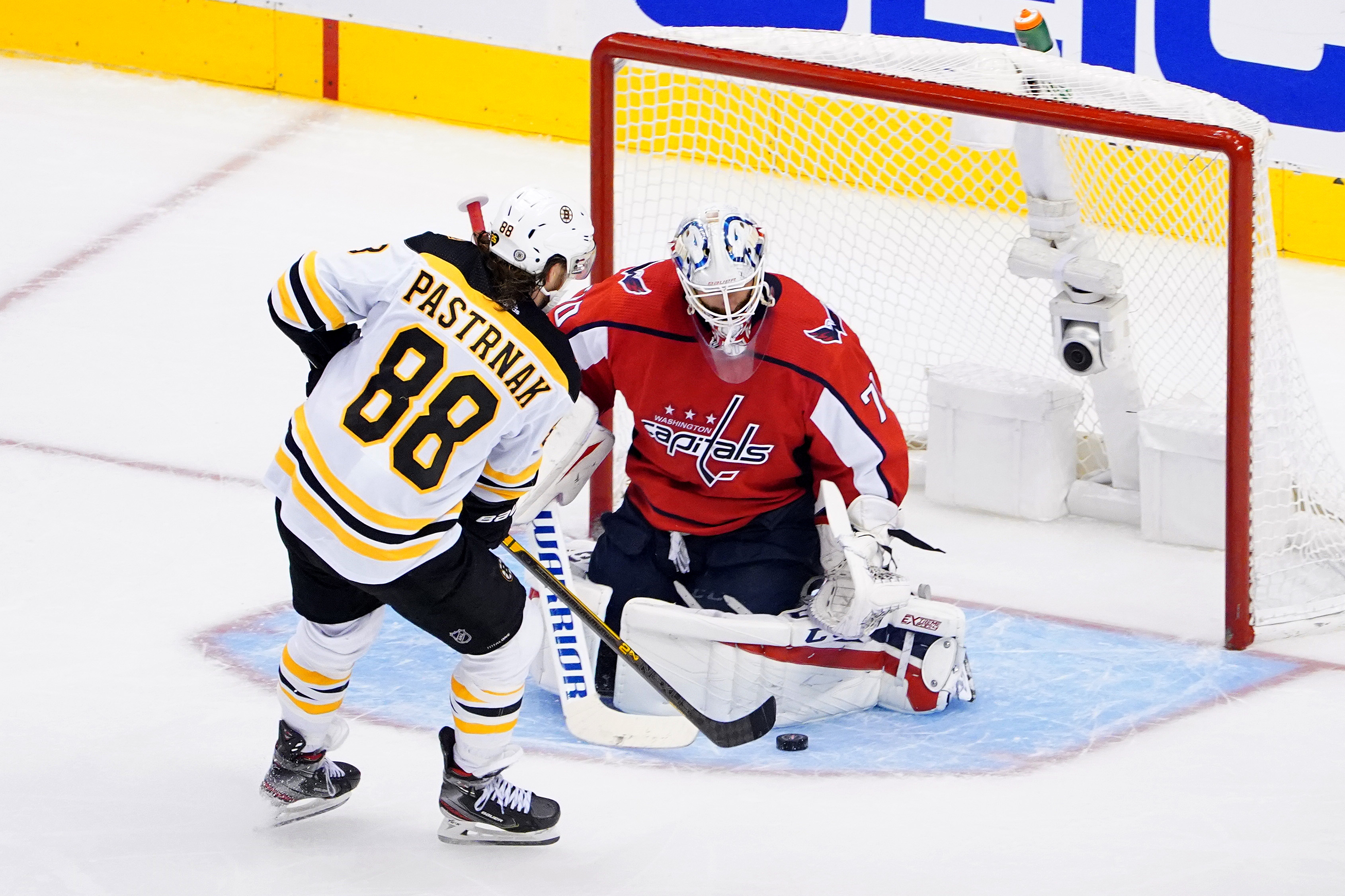 Braden Holtby tends goal against David Pastrnak during the third period of Sunday's game.