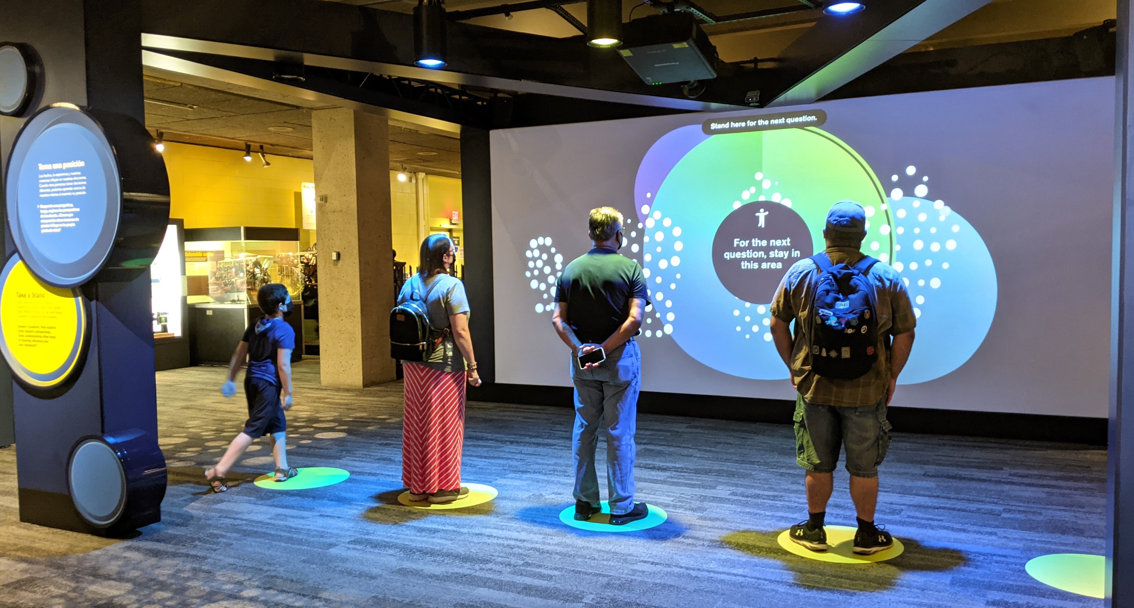 In "Take a Stand," an interactive activity in the Museum of Science's exhibit on vaccines, participants can express their opinions on vaccine-related questions.