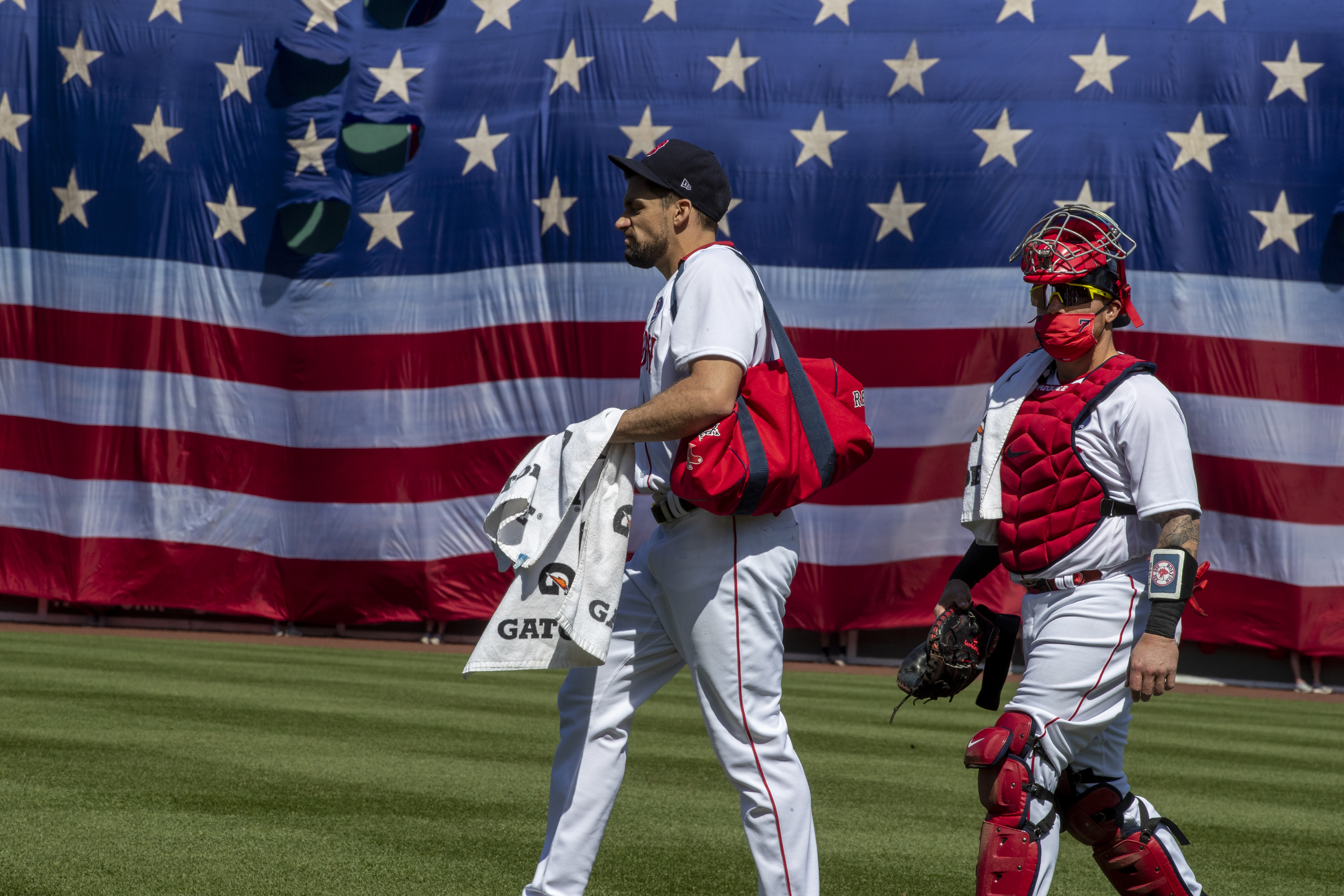 Nathan Eovaldi and Christian Vazquez walk in from the bullpen prior to the Patriots' Day win over Chicago. Eovaldi is 3-1 with a 3.04 ERA.