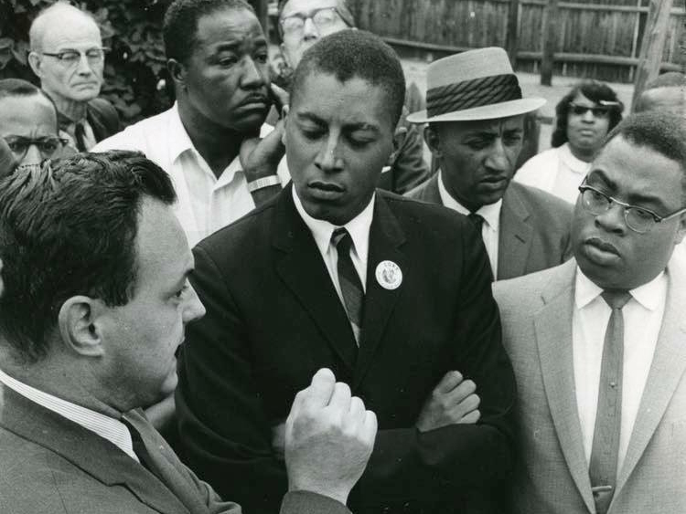 Clifford R. Montiero, center, listens as then-Mayor of Providence Joseph A. Doorley Jr. speaks during the 1960s when Montiero chaired the old Congress on Racial Equality.