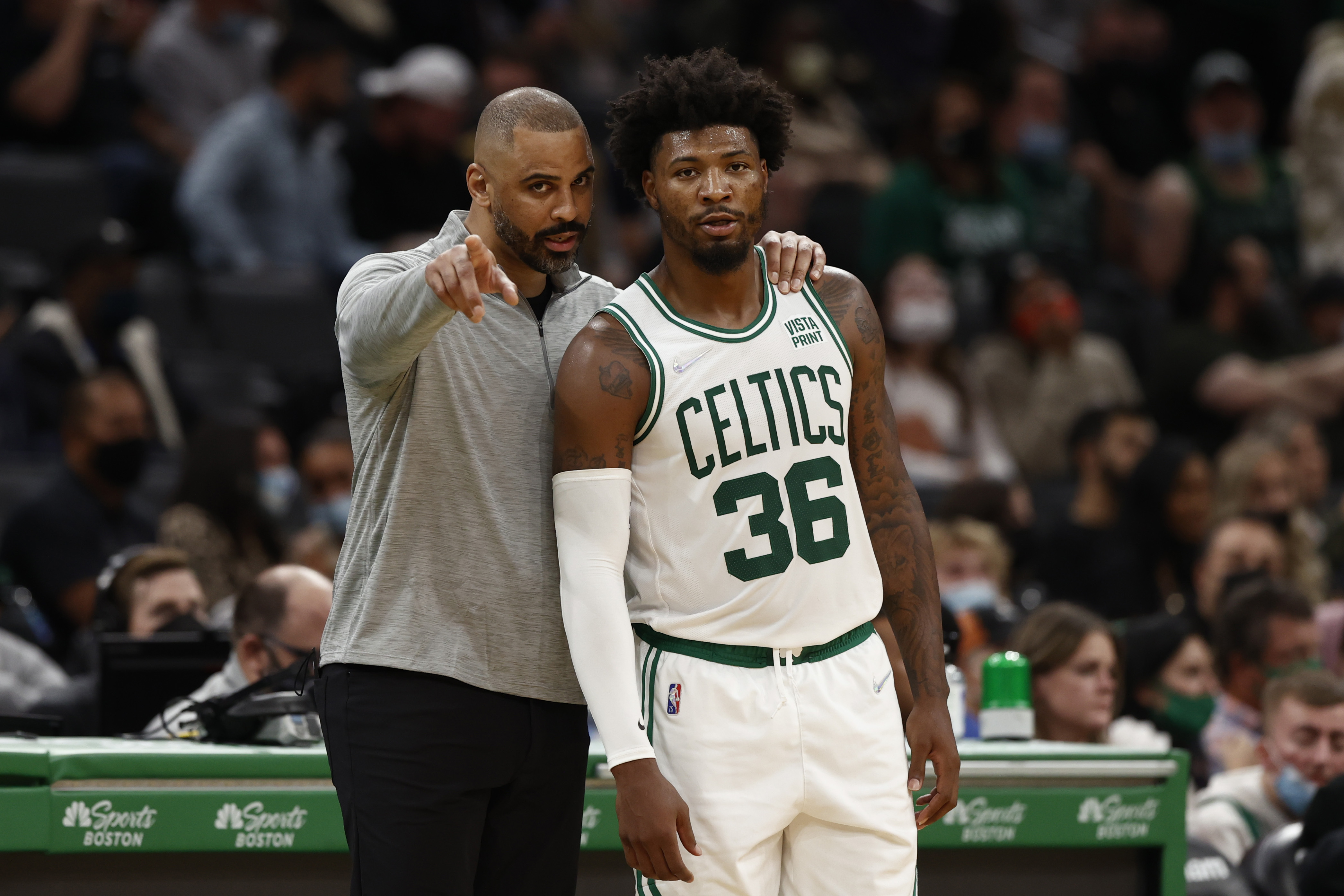 Ime Udoka offers some wisdom for Marcus Smart during a recent preseason contest.