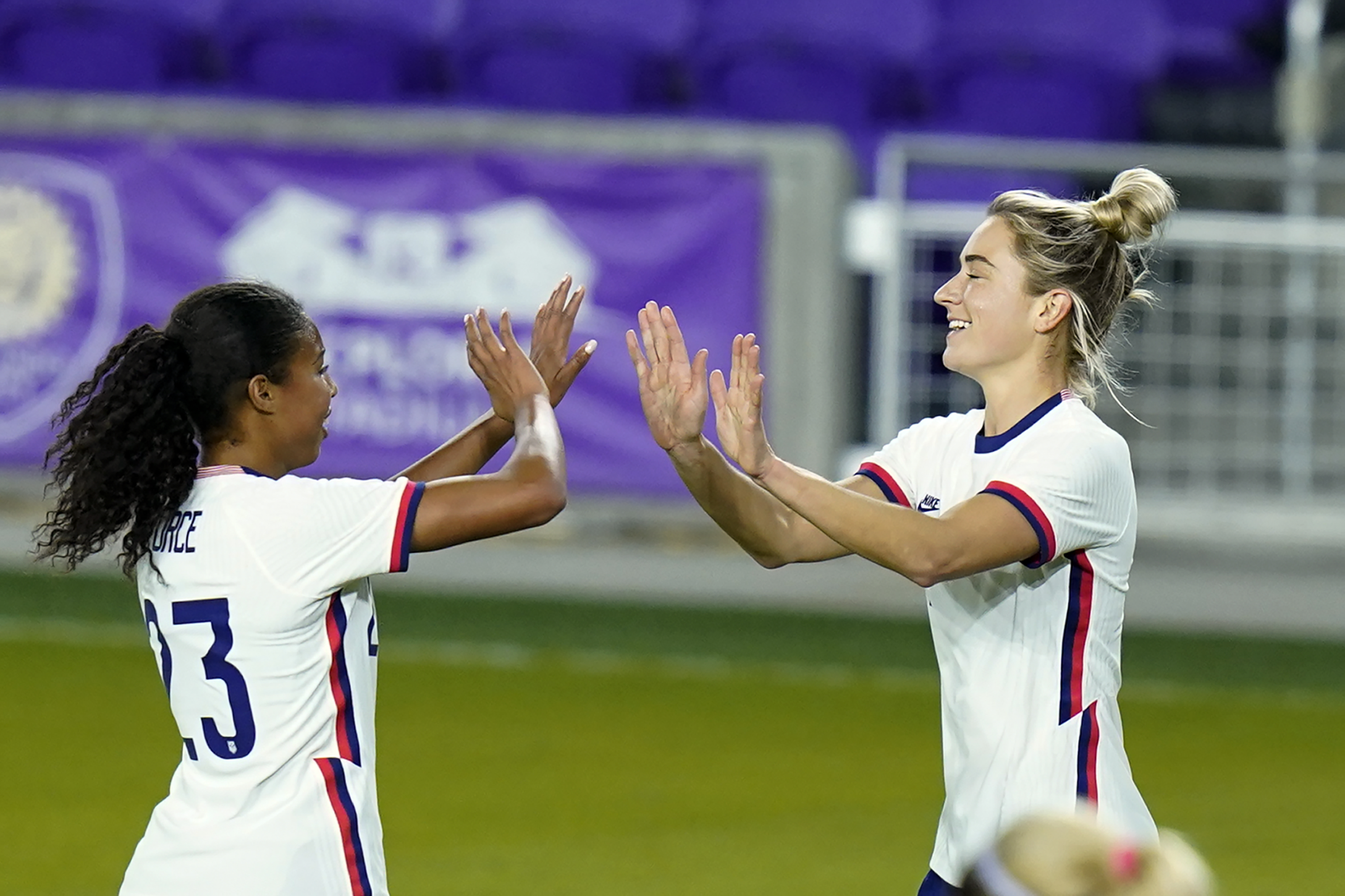 Kristie Mewis, right, celebrates her goal against Colombia with defender Margaret Purce during Monday's match.