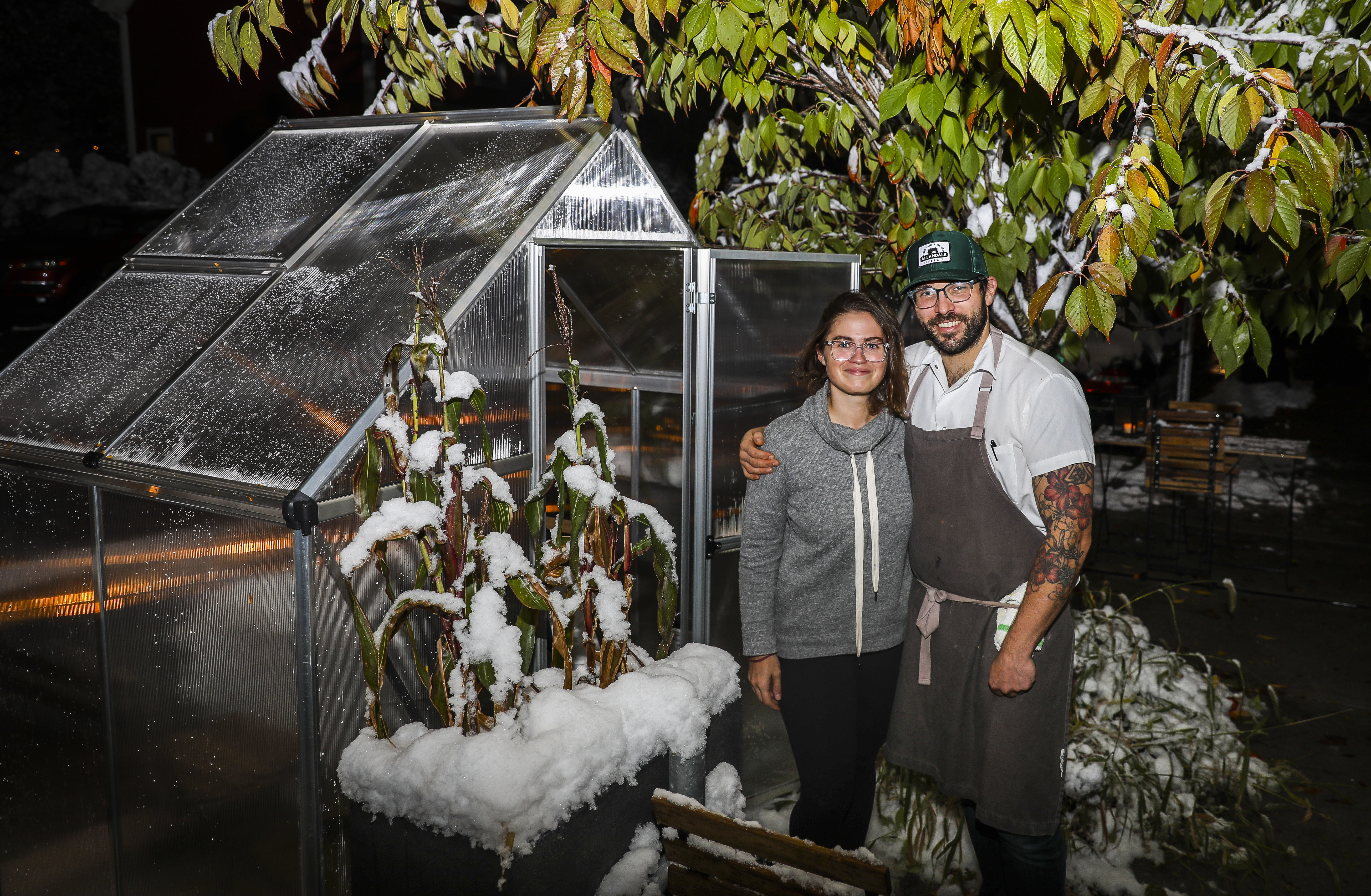 Danielle Ayer with her husband, Conor Dennehy, outside one of the greenhouses they created to allow for socially distanced eating at their restaurant, Talulla.