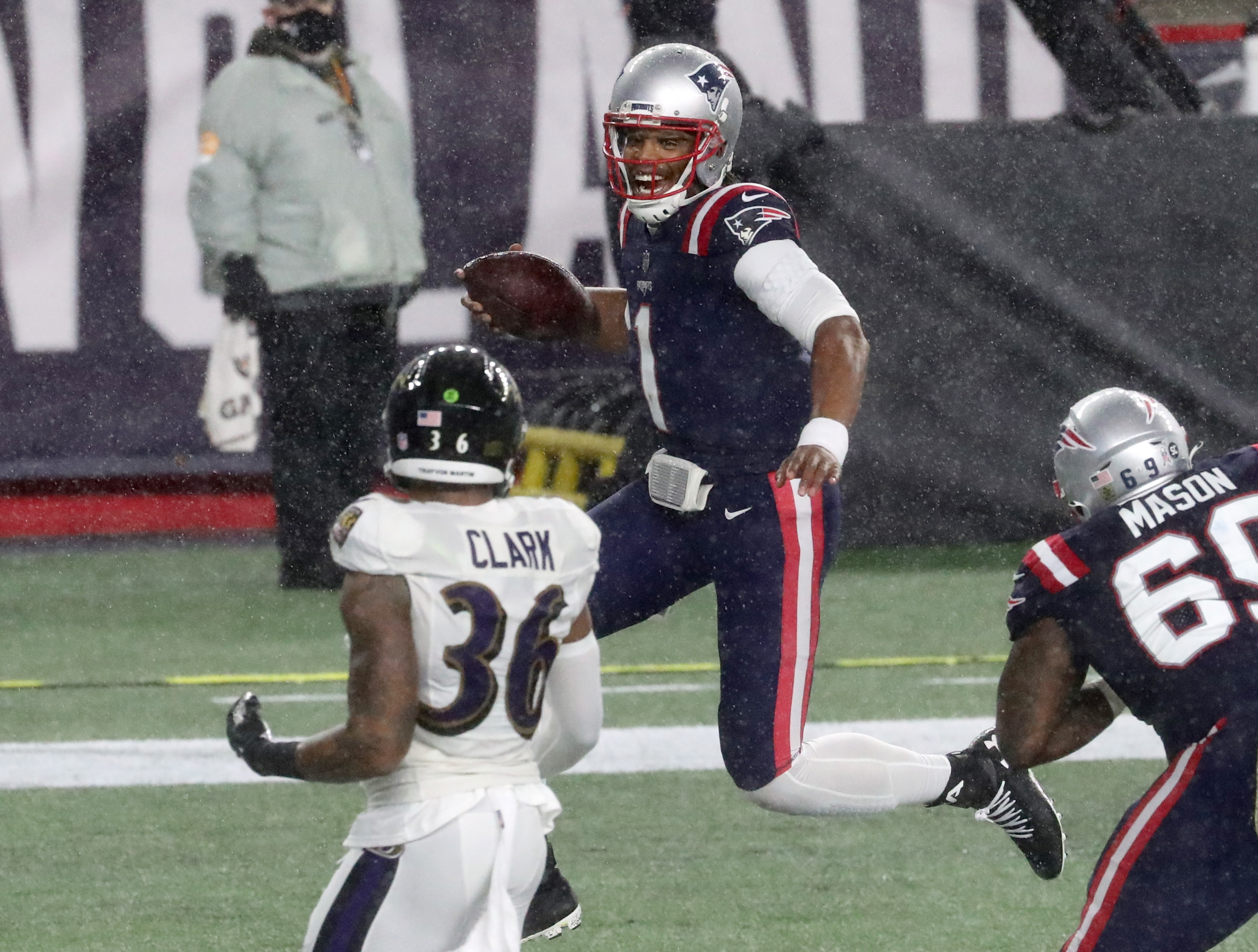 Cam Newton, Patriots shock Ravens, 23-17, in rain-soaked night at