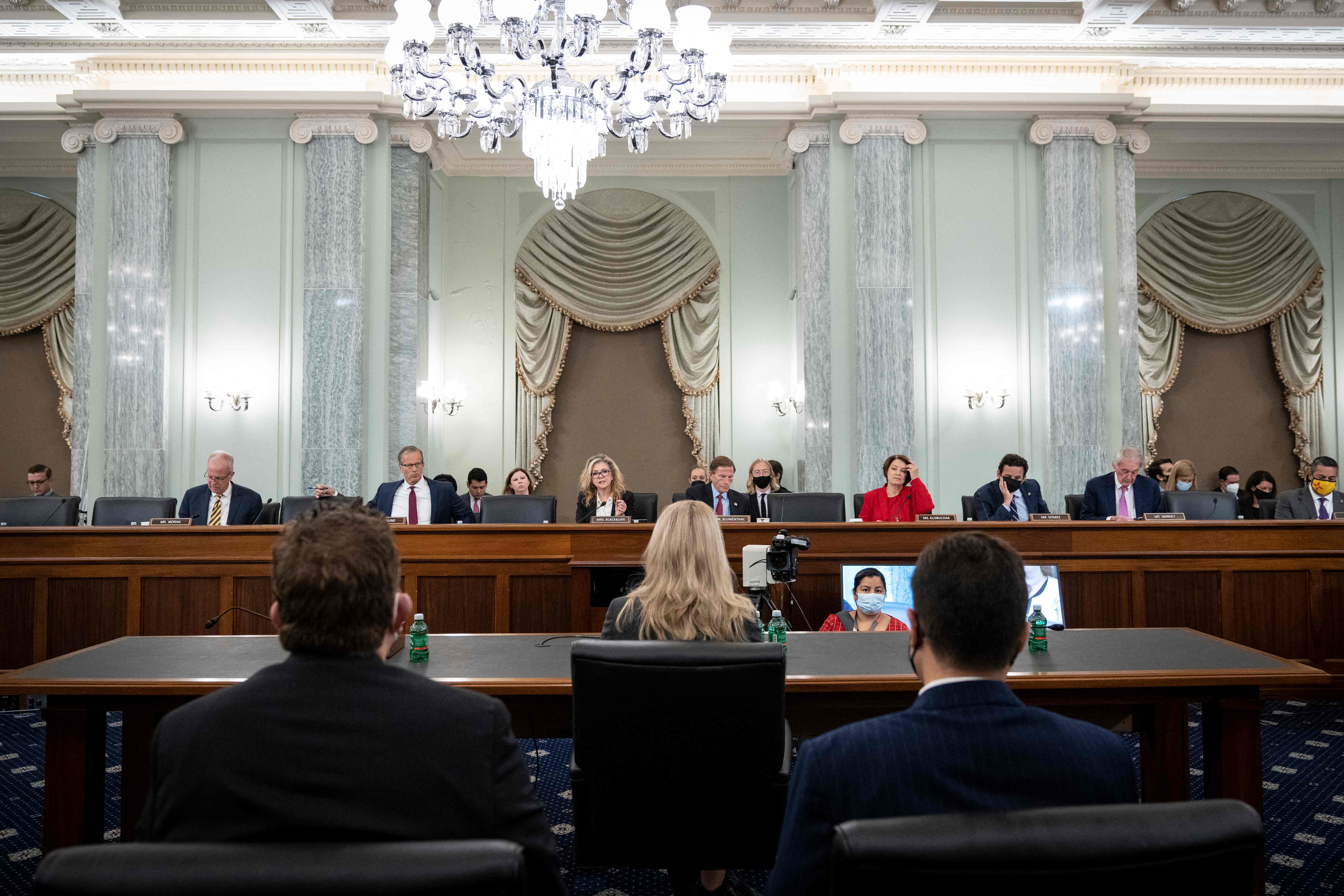 Committee Senators listen as former Facebook employee and whistleblower Frances Haugen testifies before a Senate Committee on Commerce, Science, and Transportation hearing.