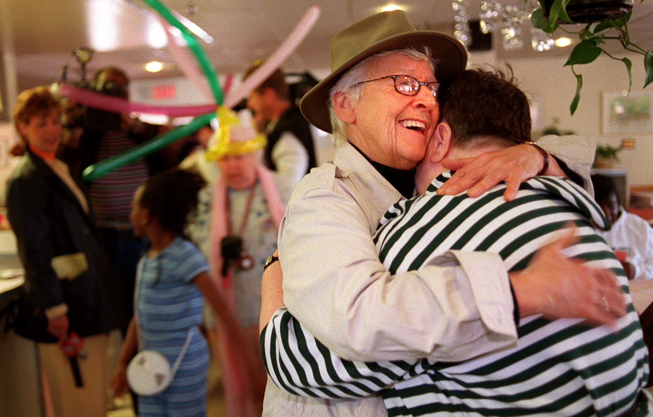 Tiernan embracing one of her first guests at the 25th anniversary of the shelter in 1999.