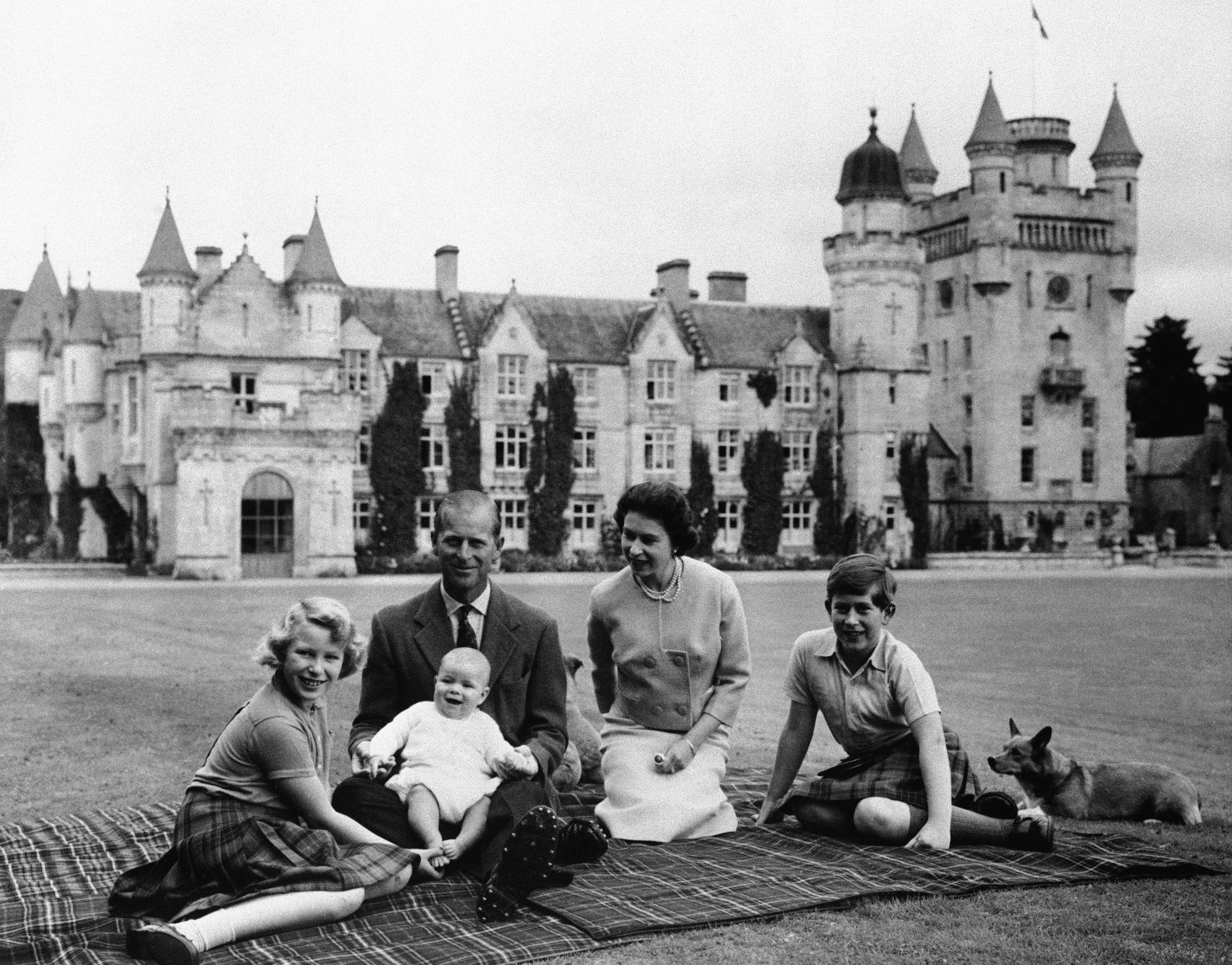 In this Sept. 1960 file photo, Britain's Queen Elizabeth, Prince Philip and their children, Prince Charles, right, Princess Anne and Prince Andrew, posed for a photo on the lawn of Balmoral Castle, in Scotland.