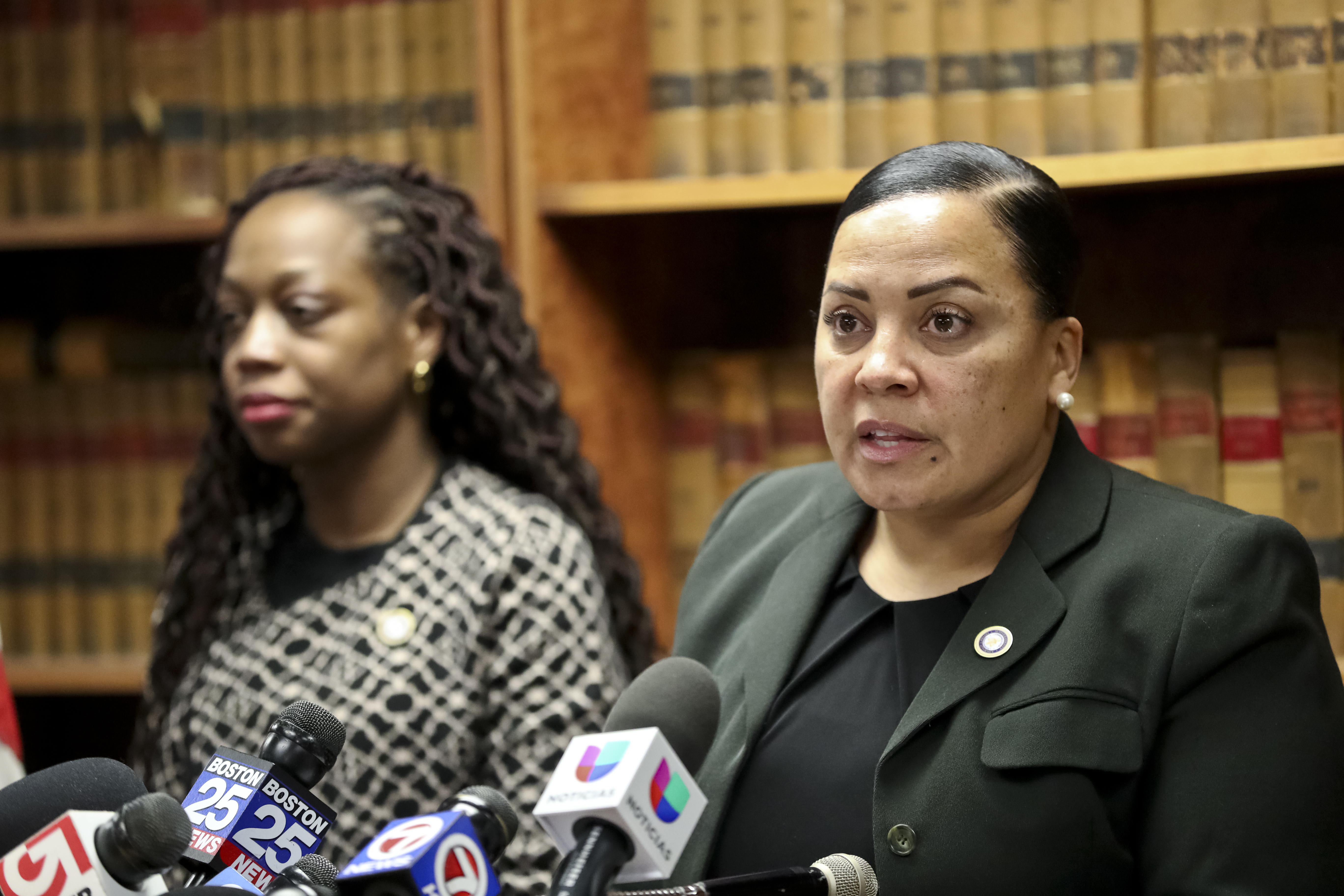 District Attorney Rachael Rollins (right) and Charlene Luma (left), chief of Victim-Witness Advocates, during a news conference discussing the Christmas Day incident at a Boston parking garage.