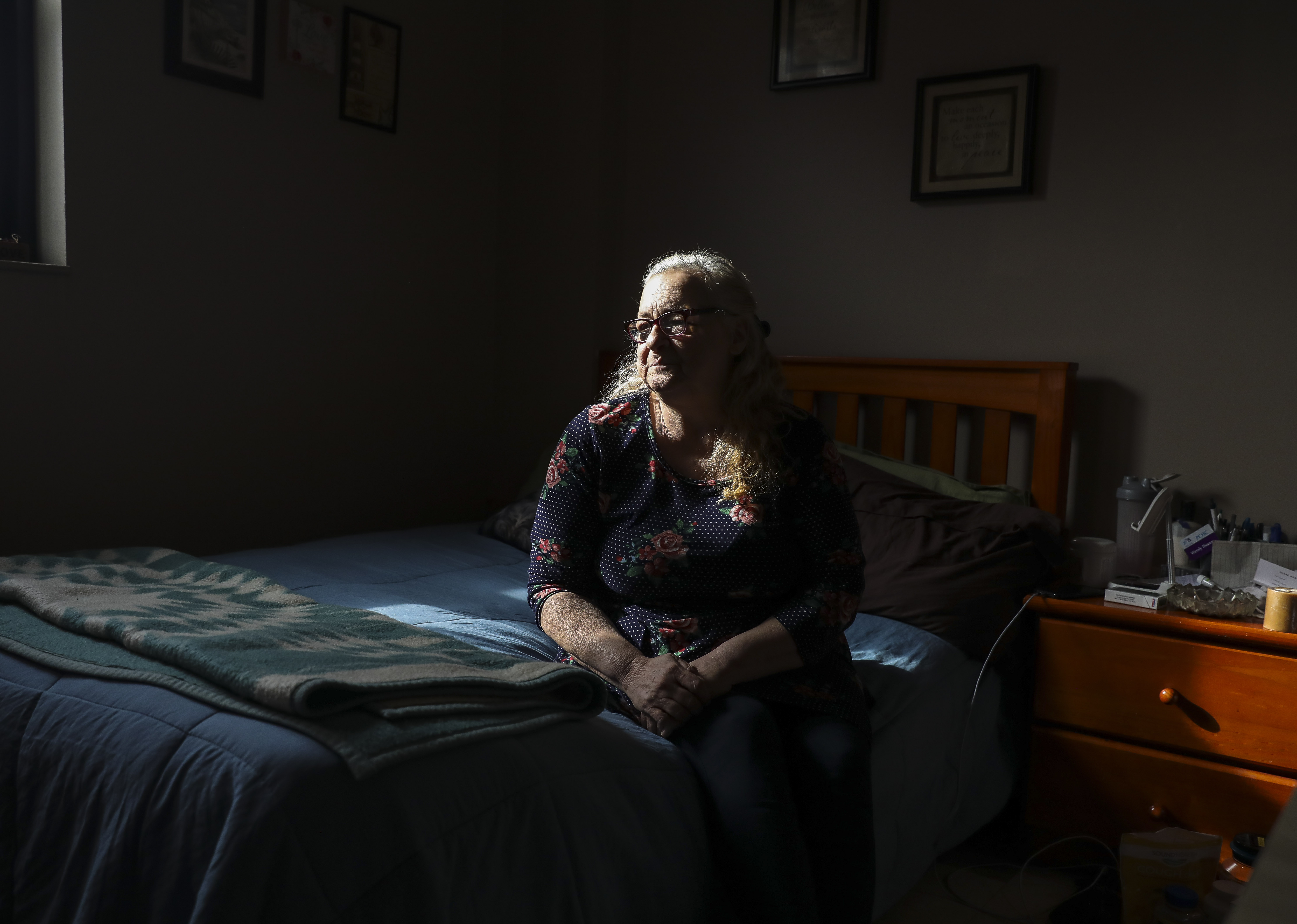 Wendy Thomas sits in her Section 8 apartment in Providence on Wednesday afternoon. Unlike other states in New England, Rhode Island still doesn't have a dedicated stream of funding for affordable housing.