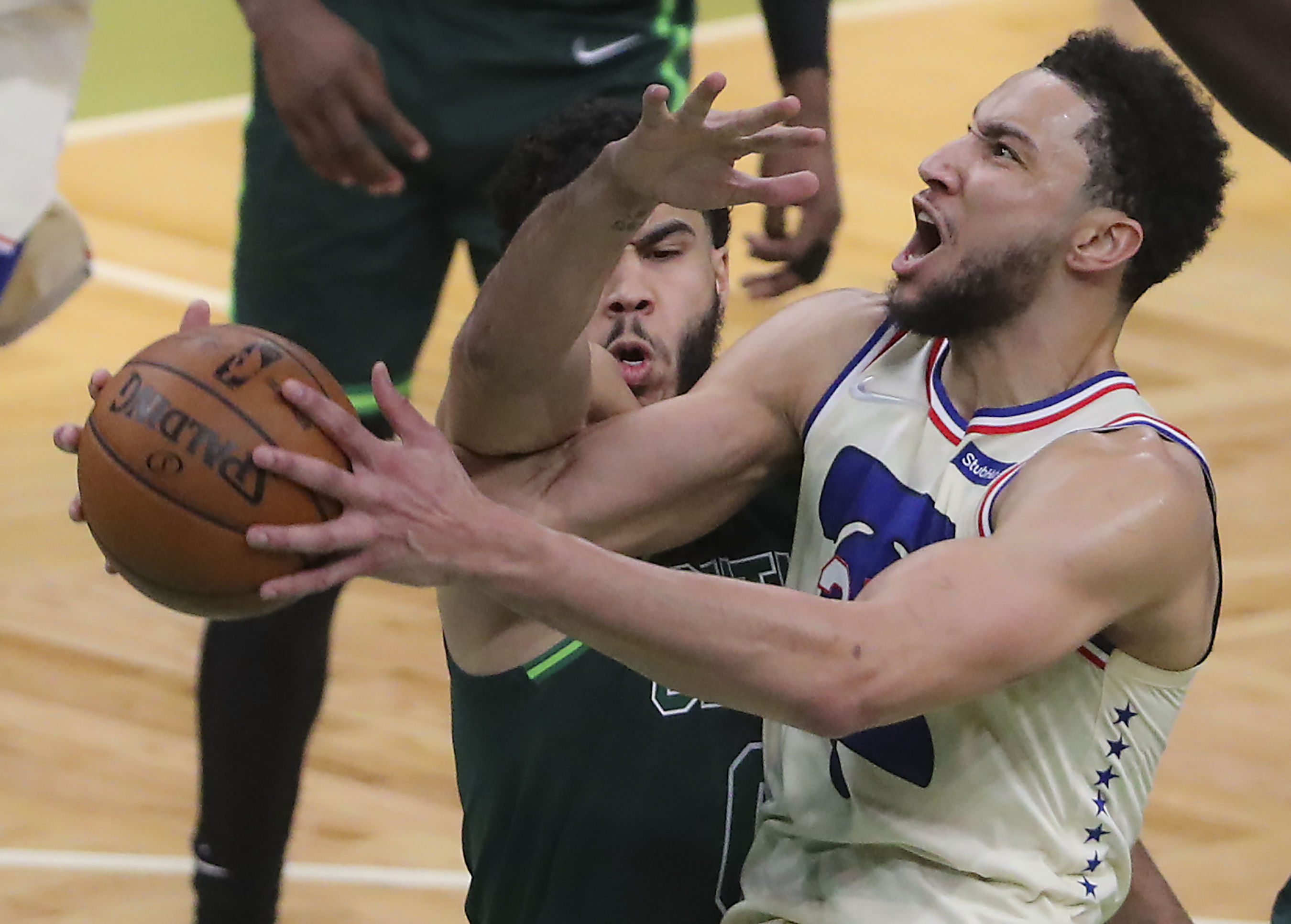 Philadelphia's Ben Simmons is fouled by Jayson Tatum in the thirs quarter Tuesday night.
