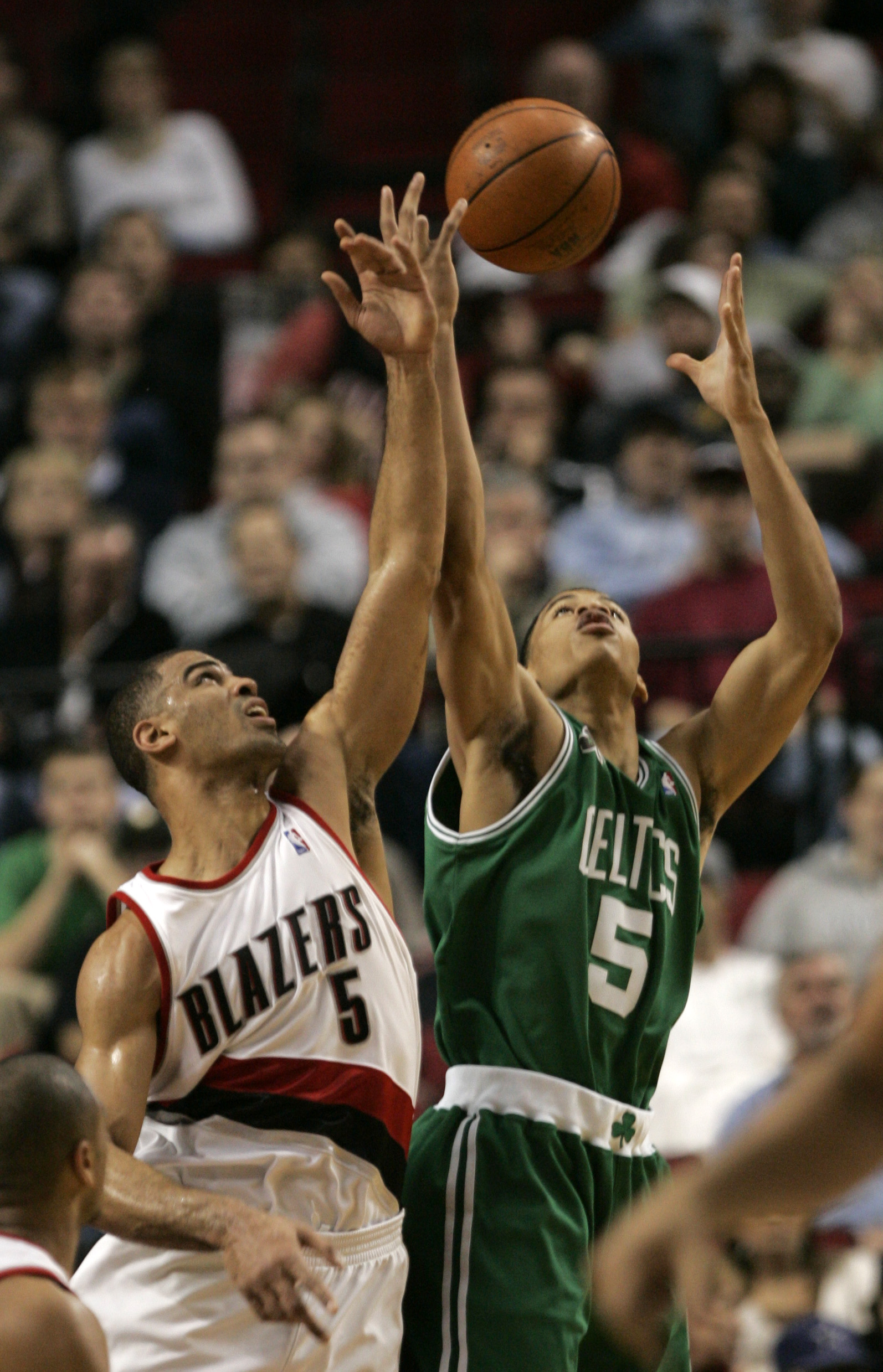 As a member of the Trail Blazers, Ime Udoka battles Boston's Gerald Green for a rebound in a 2007 contest in Porland.