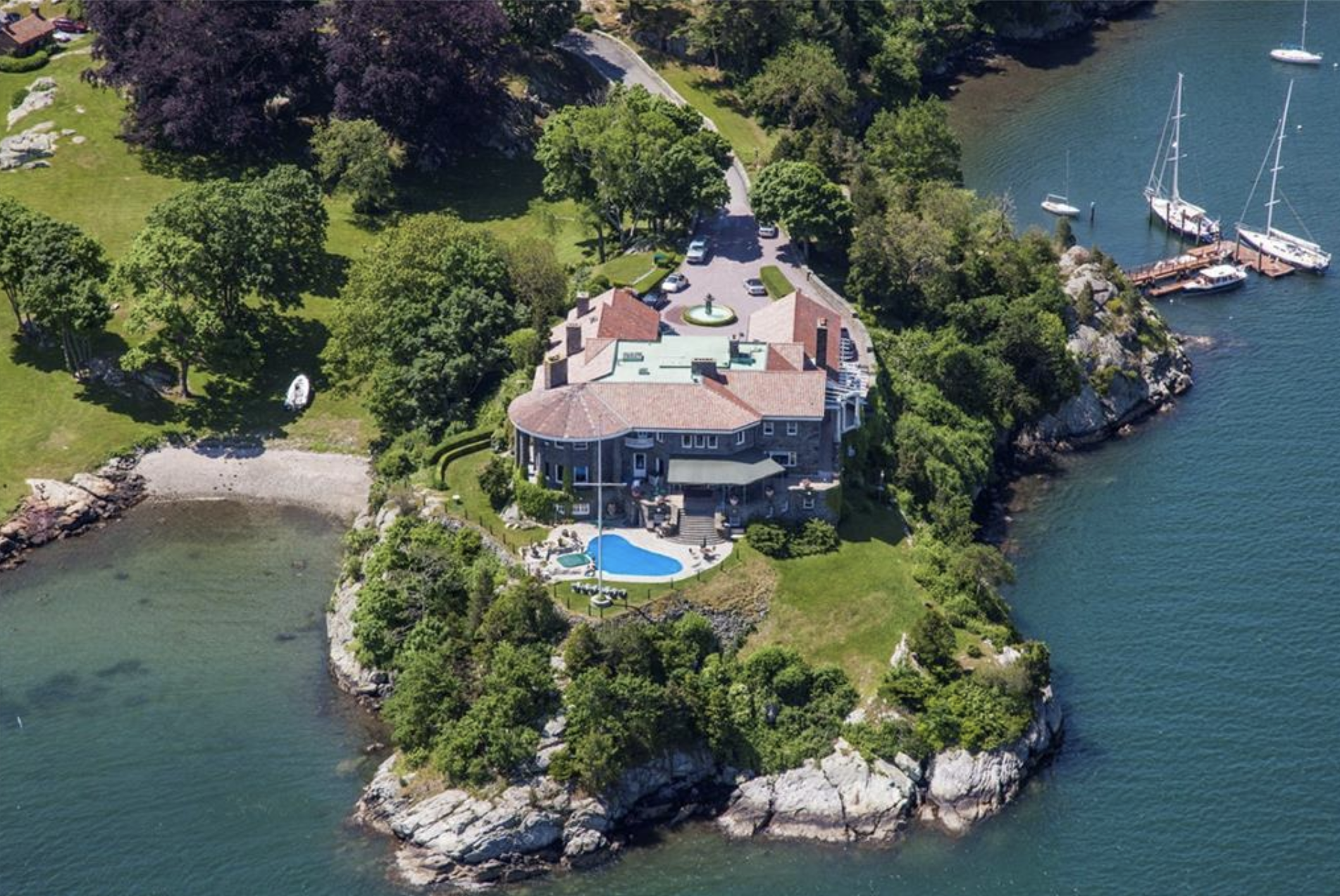Beacon Rock at 147 Harrison Street in Newport, Rhode Island is a 19,000-square-foot mansion.  It is accessed by a winding road surrounded by Newport Harbour.