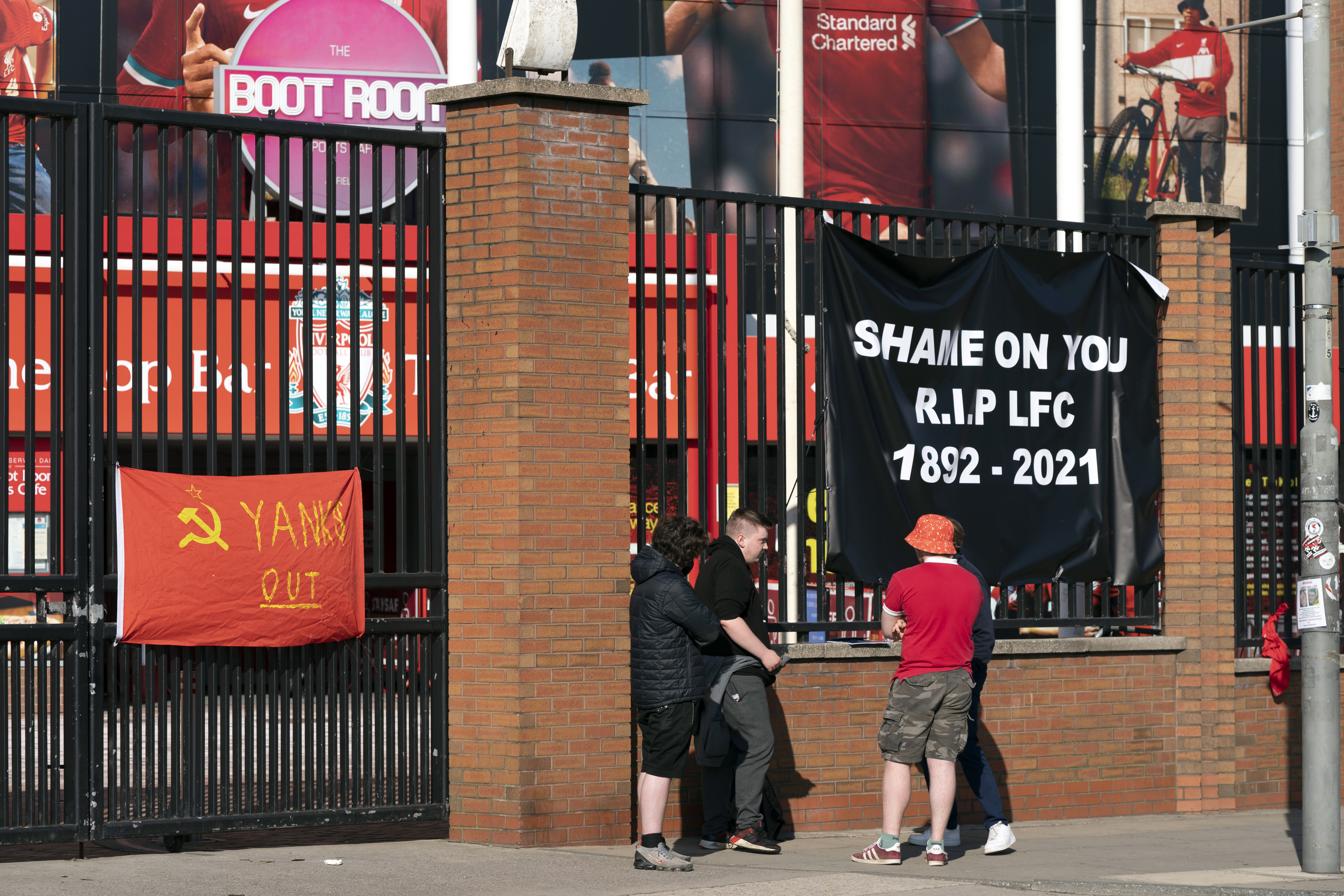 Banners are seen outside Liverpool's Anfield Stadium on Monday protesting the formation of the European Super League.