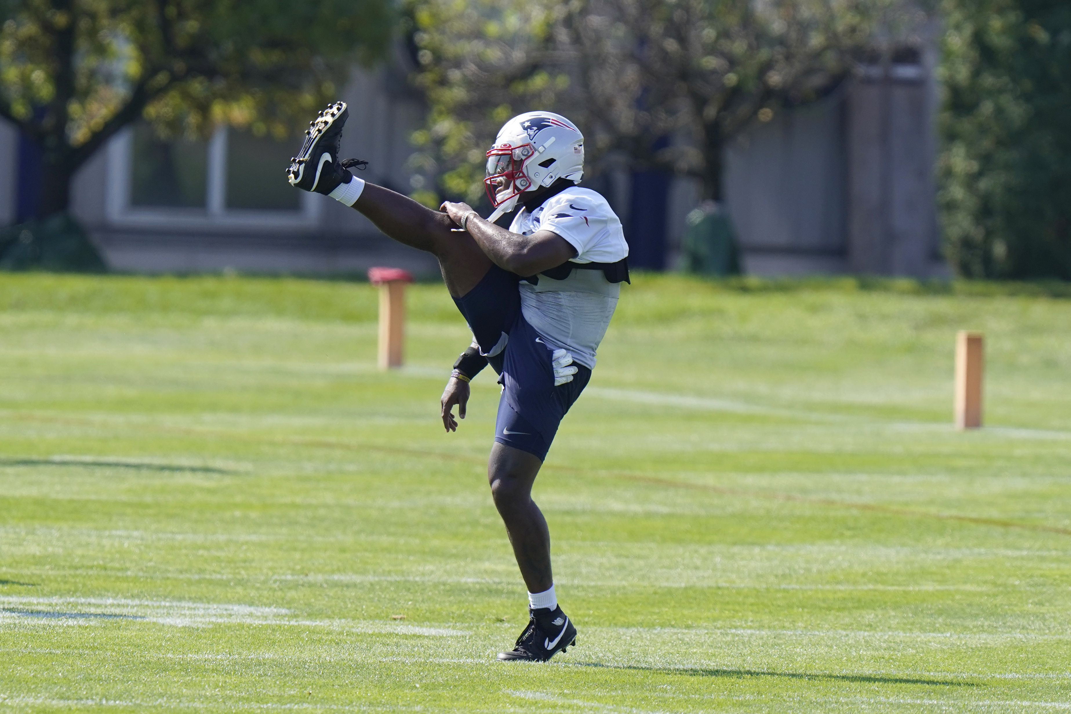Damien Harris warms up before a recent camp workout.
