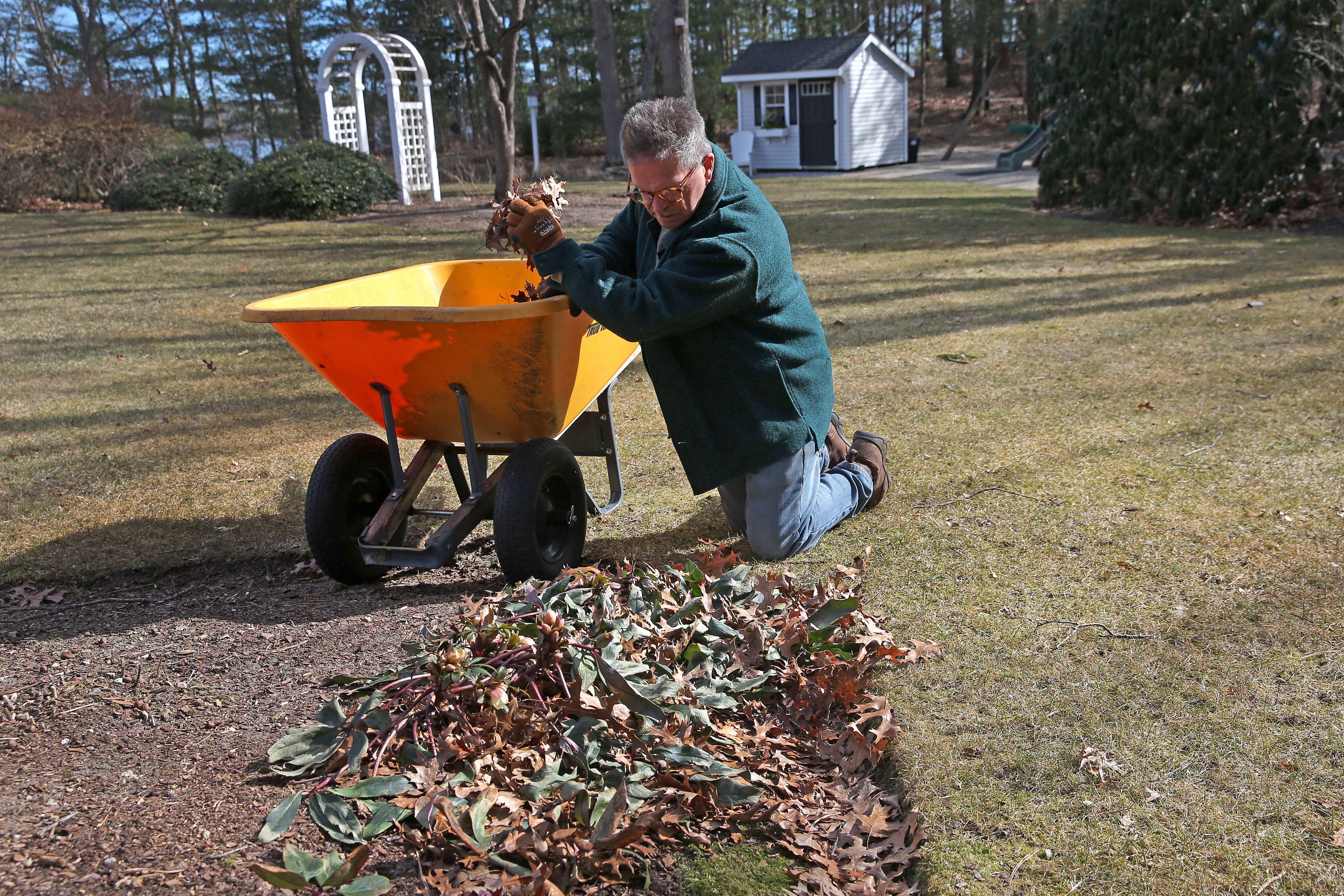 George Stanchfield works on a lakeside property in Plympton.