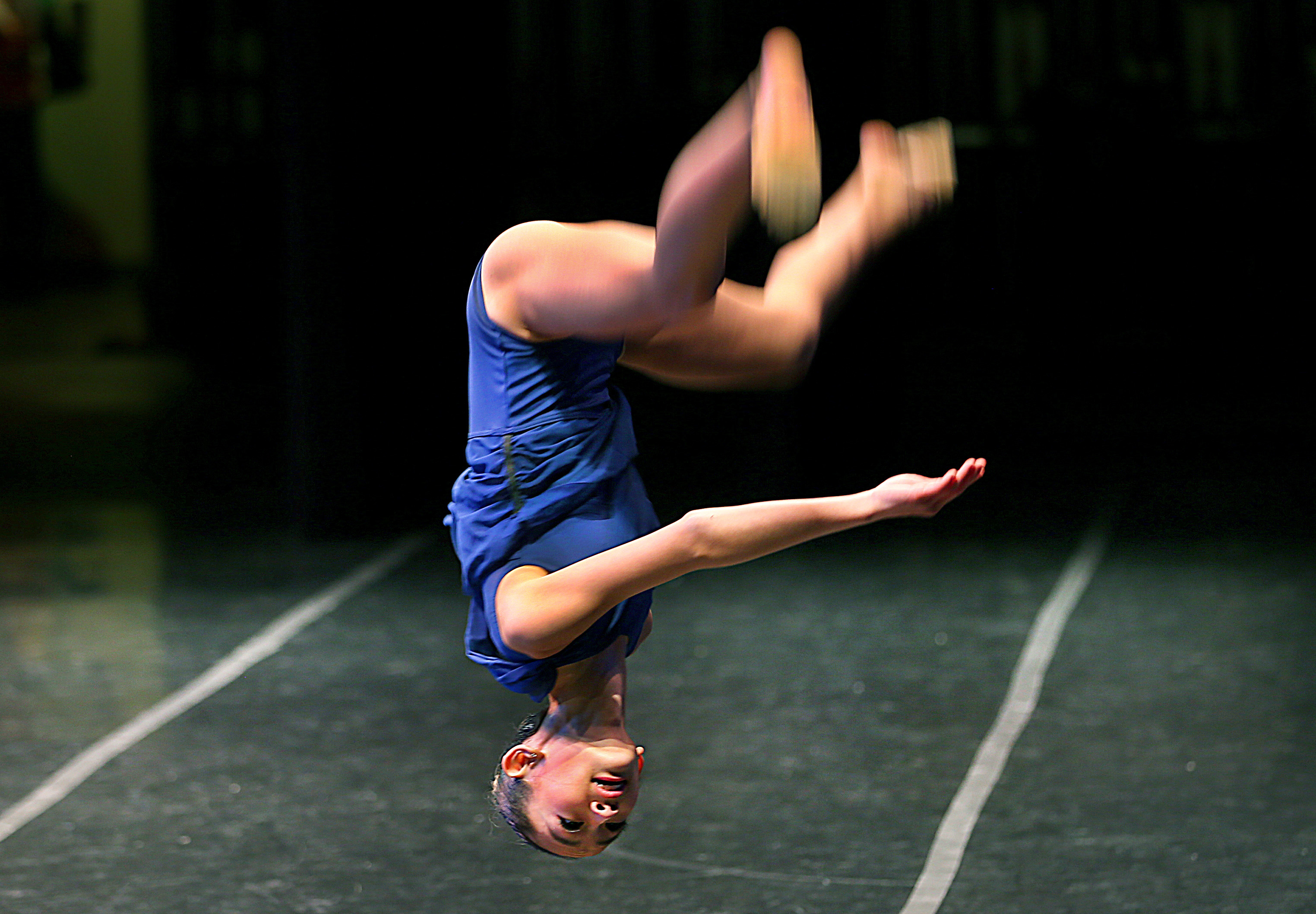 Dancer Bella Choi does a flip on stage during her performance, as hundreds of dancers auditioned for the Youth America Grand Prix.