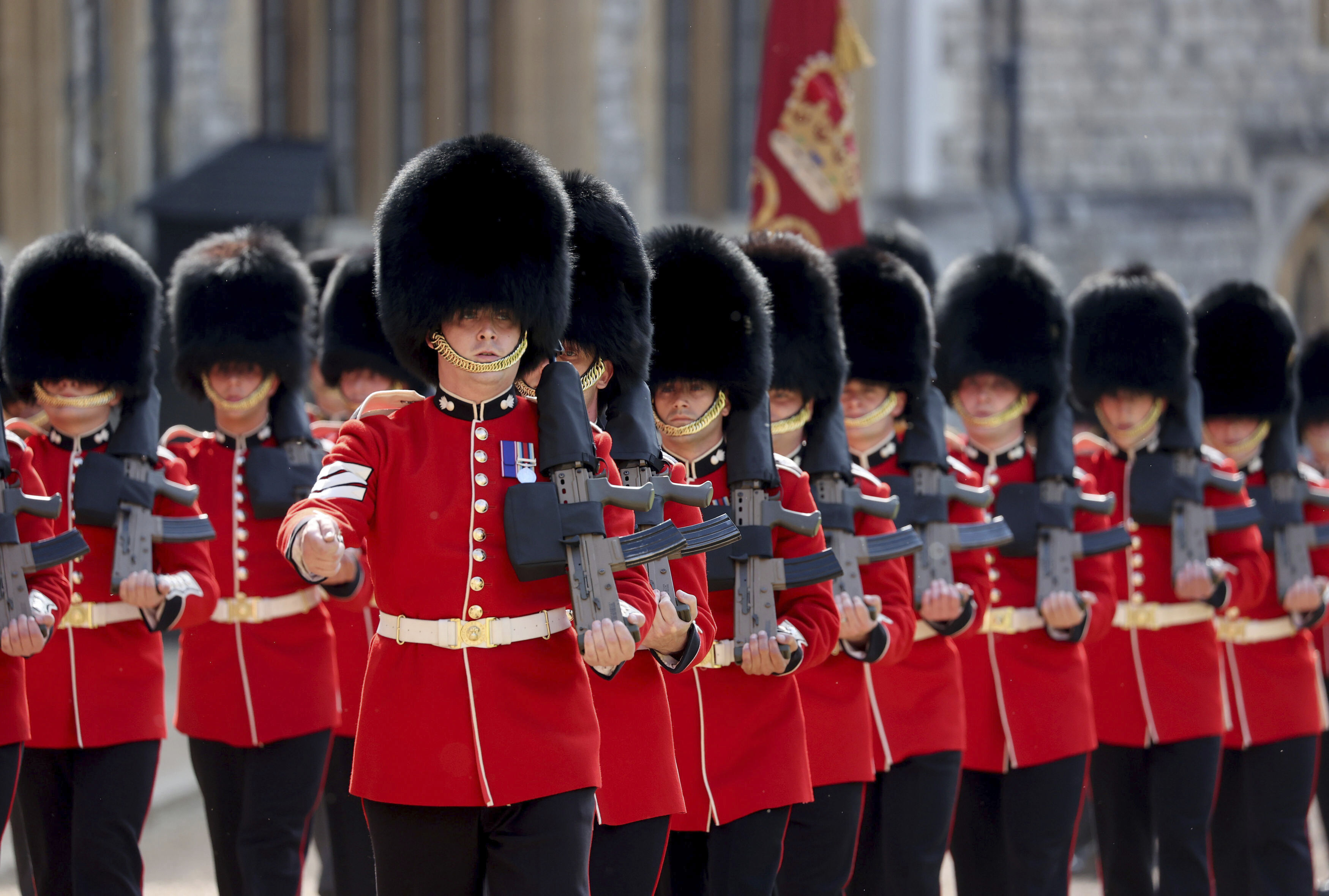 Soldiers of the Queen's Company First Battalion Grenadier Guards positioned themselves in the Quadrangle of Windsor Castle ahead of the Bidens' arrival.