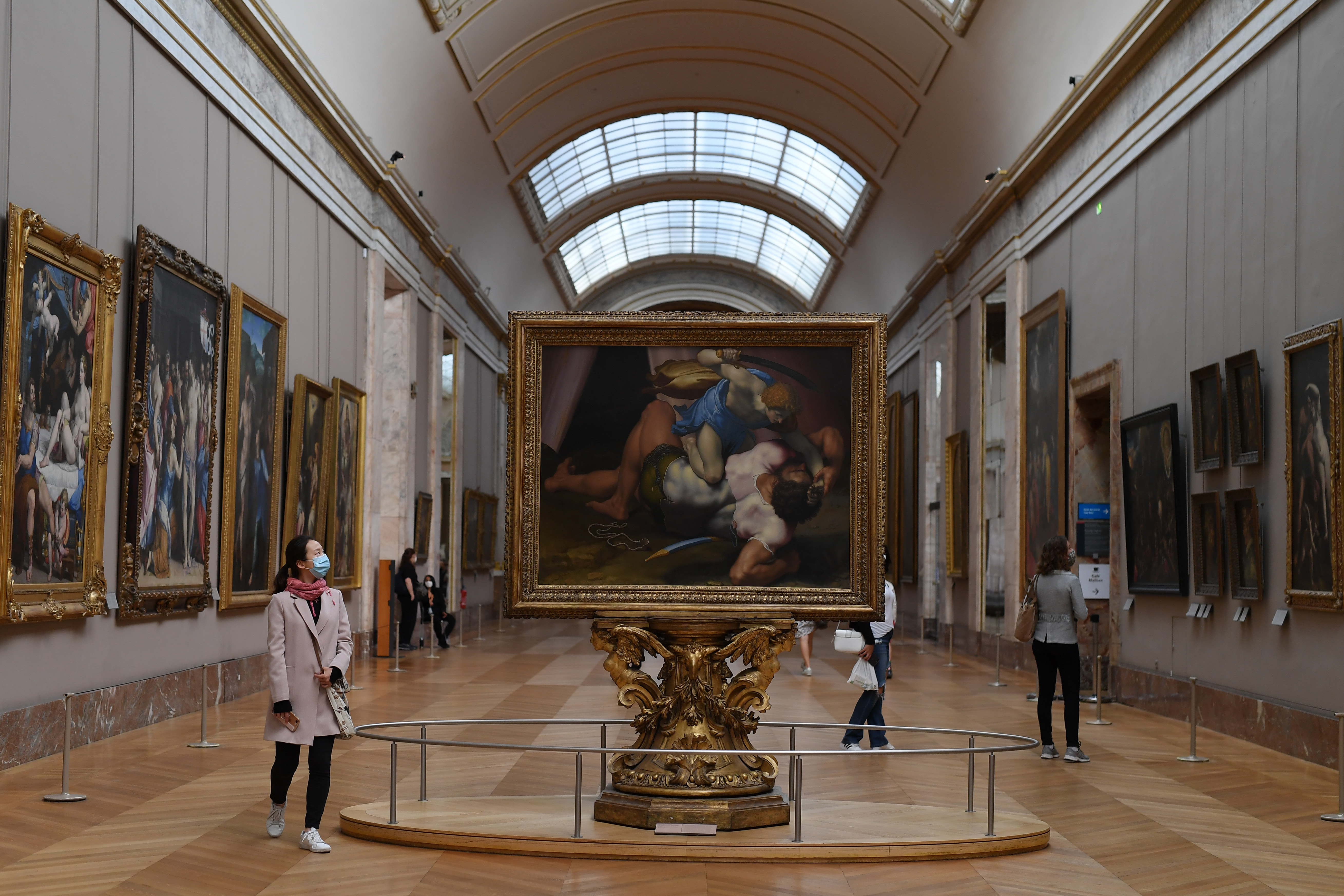 Visitors are seen at the Louvre museum as it reopened its doors.