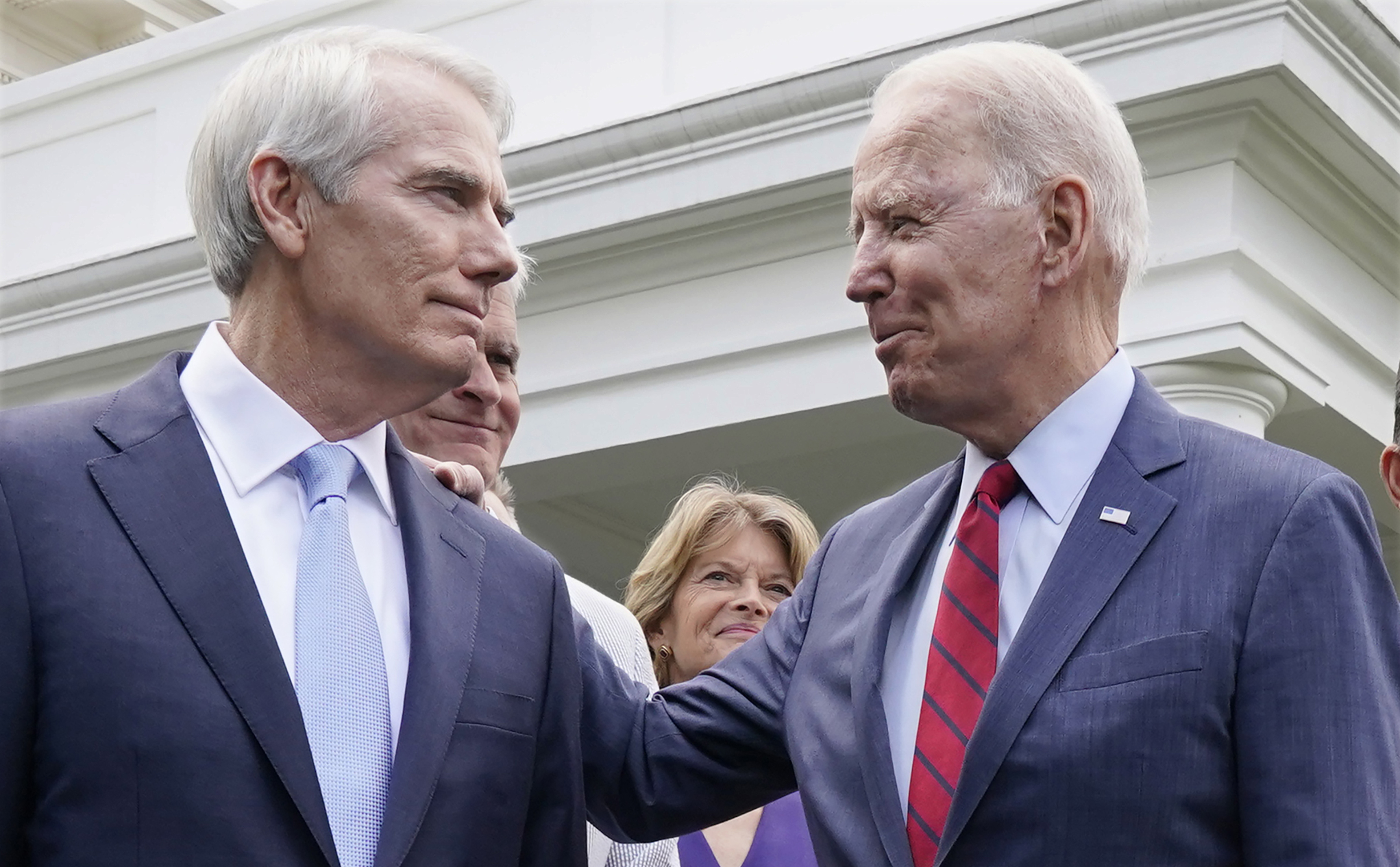 Senator Rob Portman, R-Ohio, left, and other senators, spoke with President Biden at the White House on Wednesday.