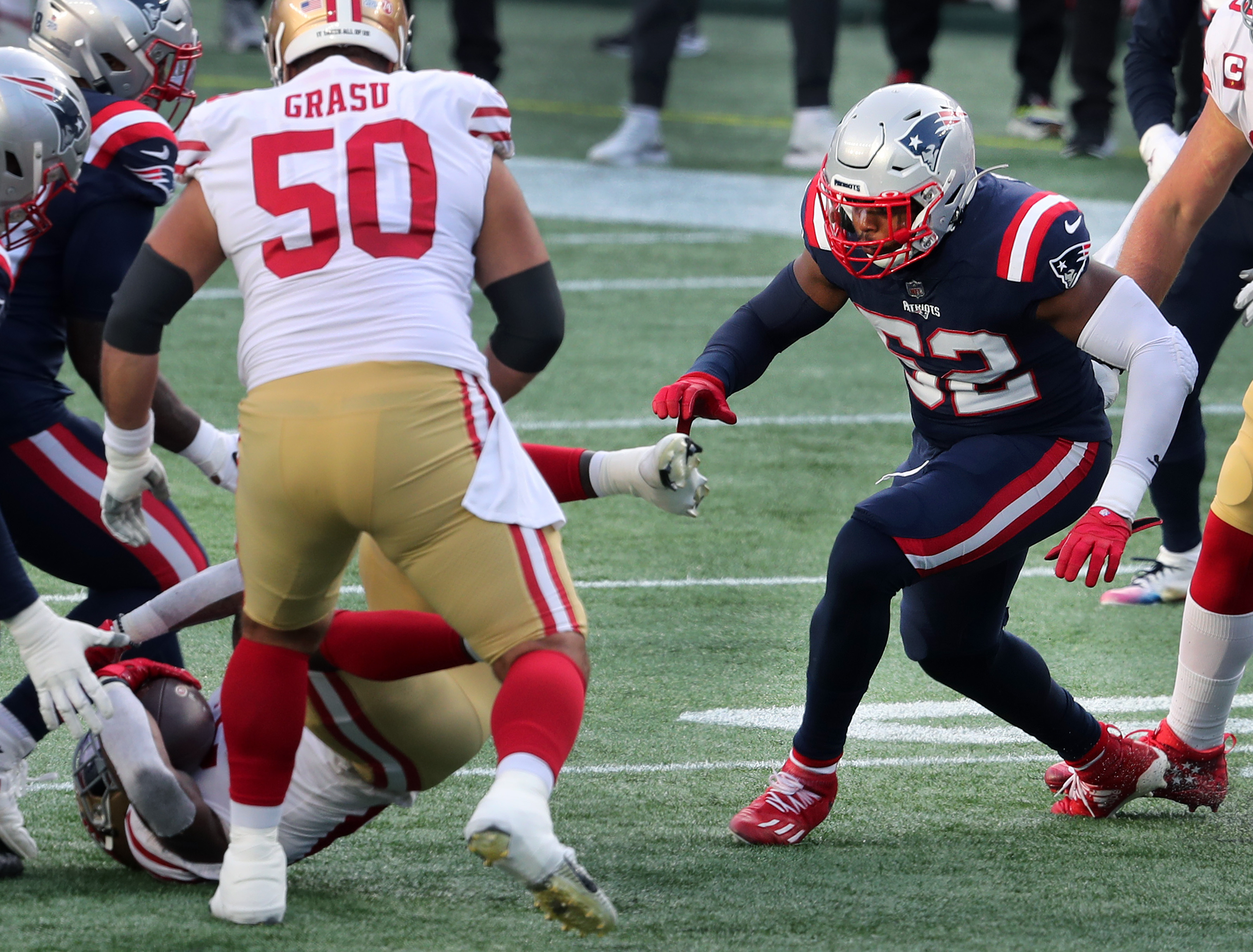 Brandon Copeland (52) closes in for a tackle Sunday against the Niners.