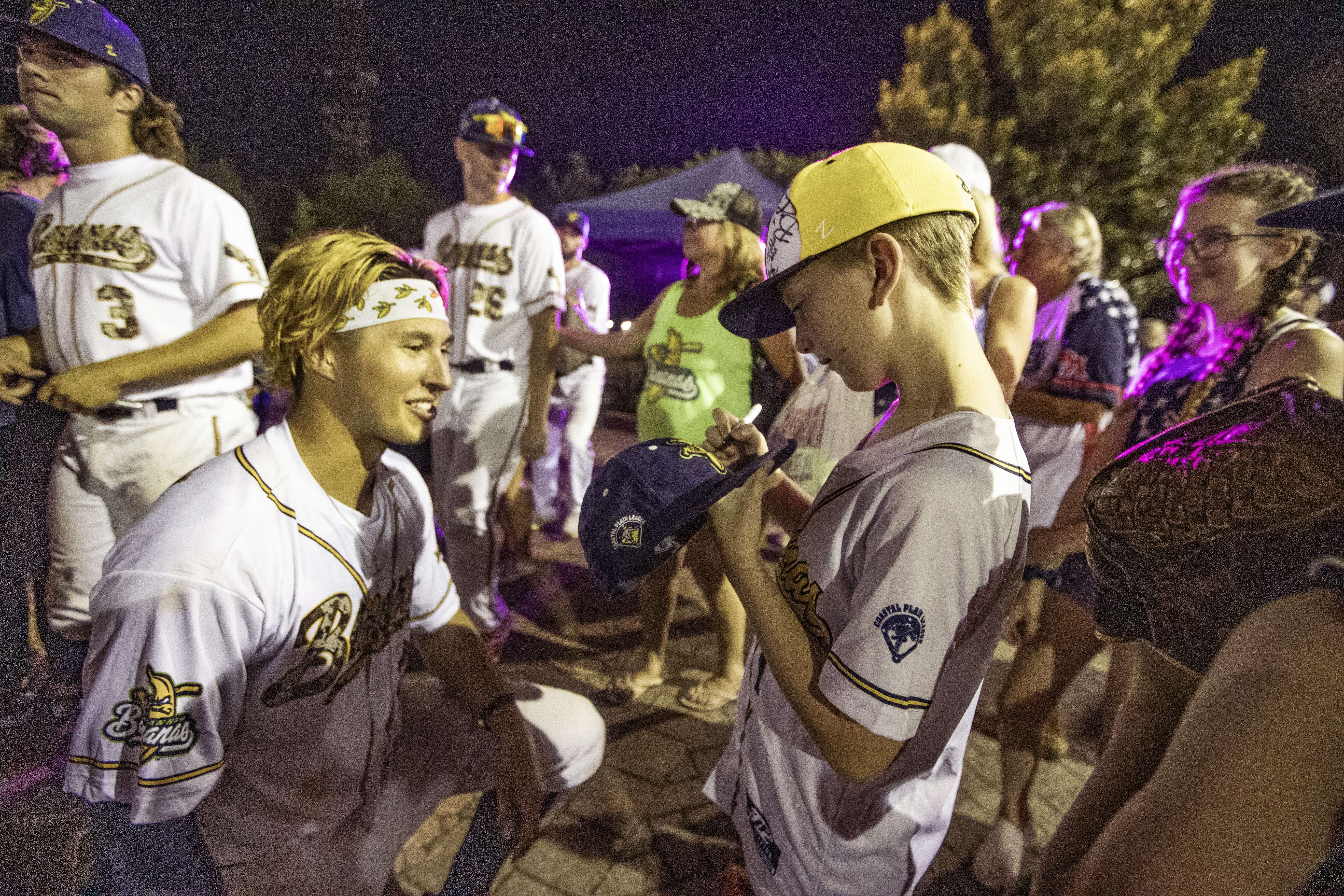 One young boy summoned the courage to ask a Bananas pitcher Christopher Dearman if he would sign his cap.