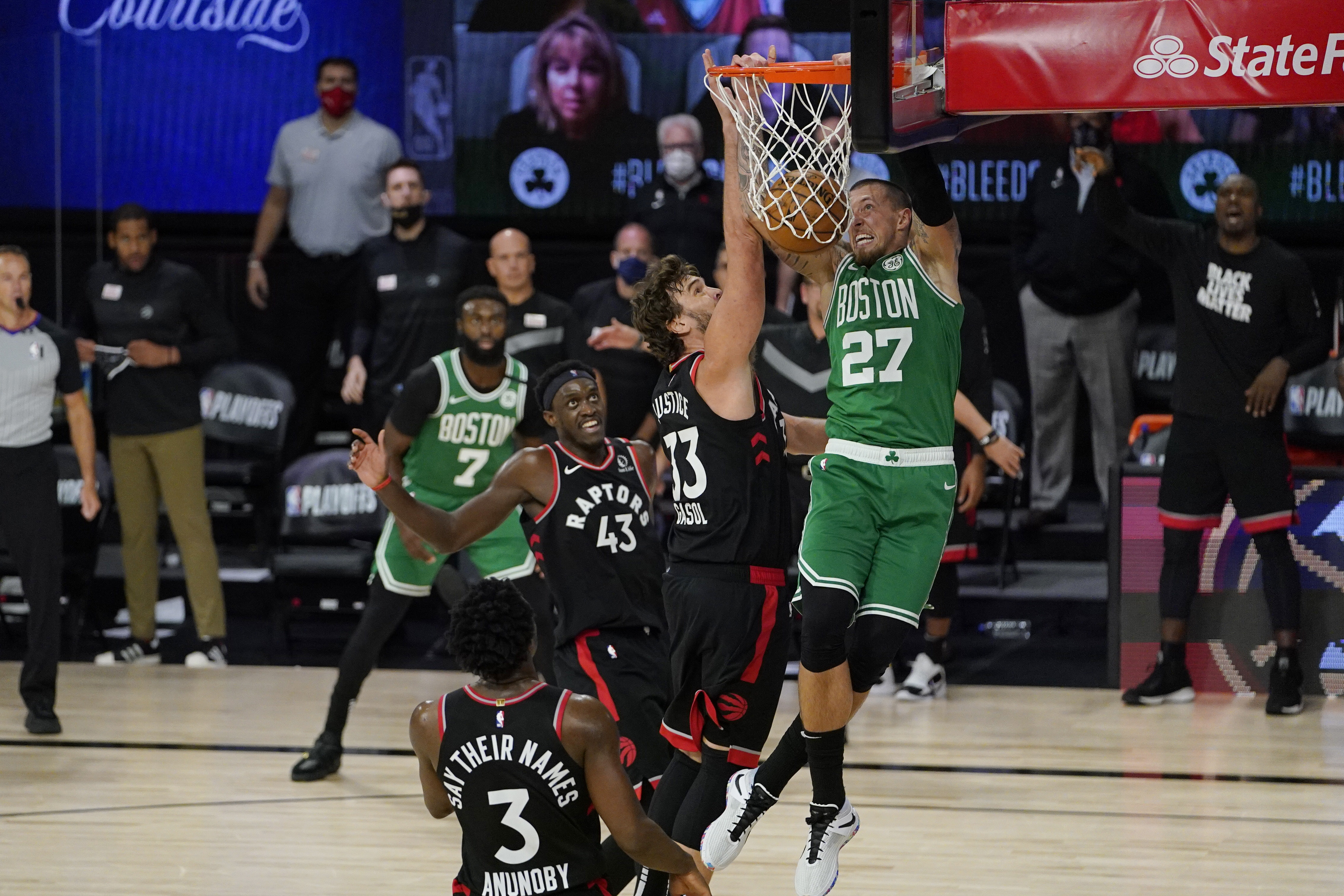 Daniel Theis dunks in front of Toronto's Marc Gasol in the first half of Thursday's game.