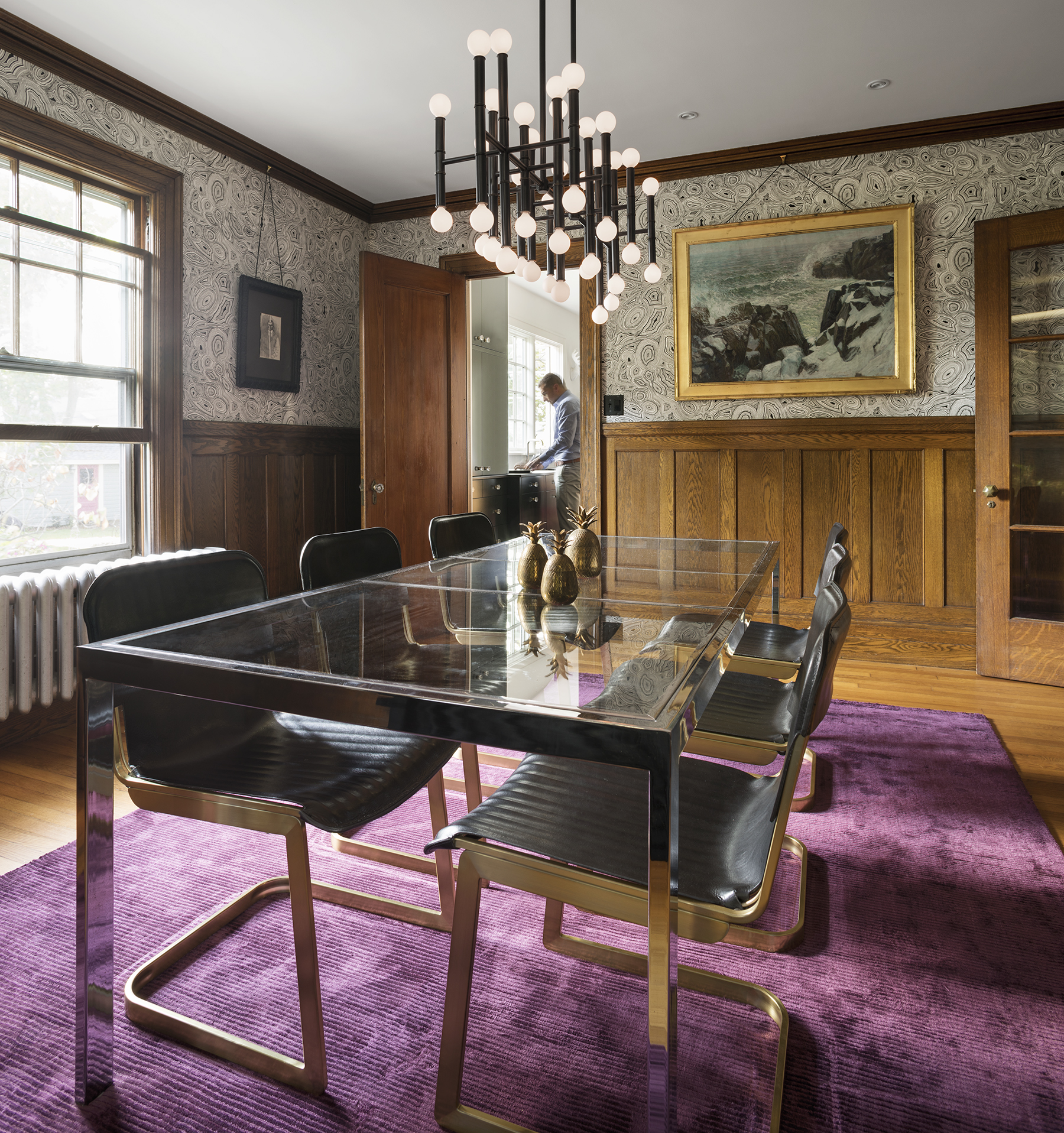 An early 1900s work by local artist Francis J. Flanagan hangs on top of Cole & Son Malachite wallpaper by Piero Fornasetti.