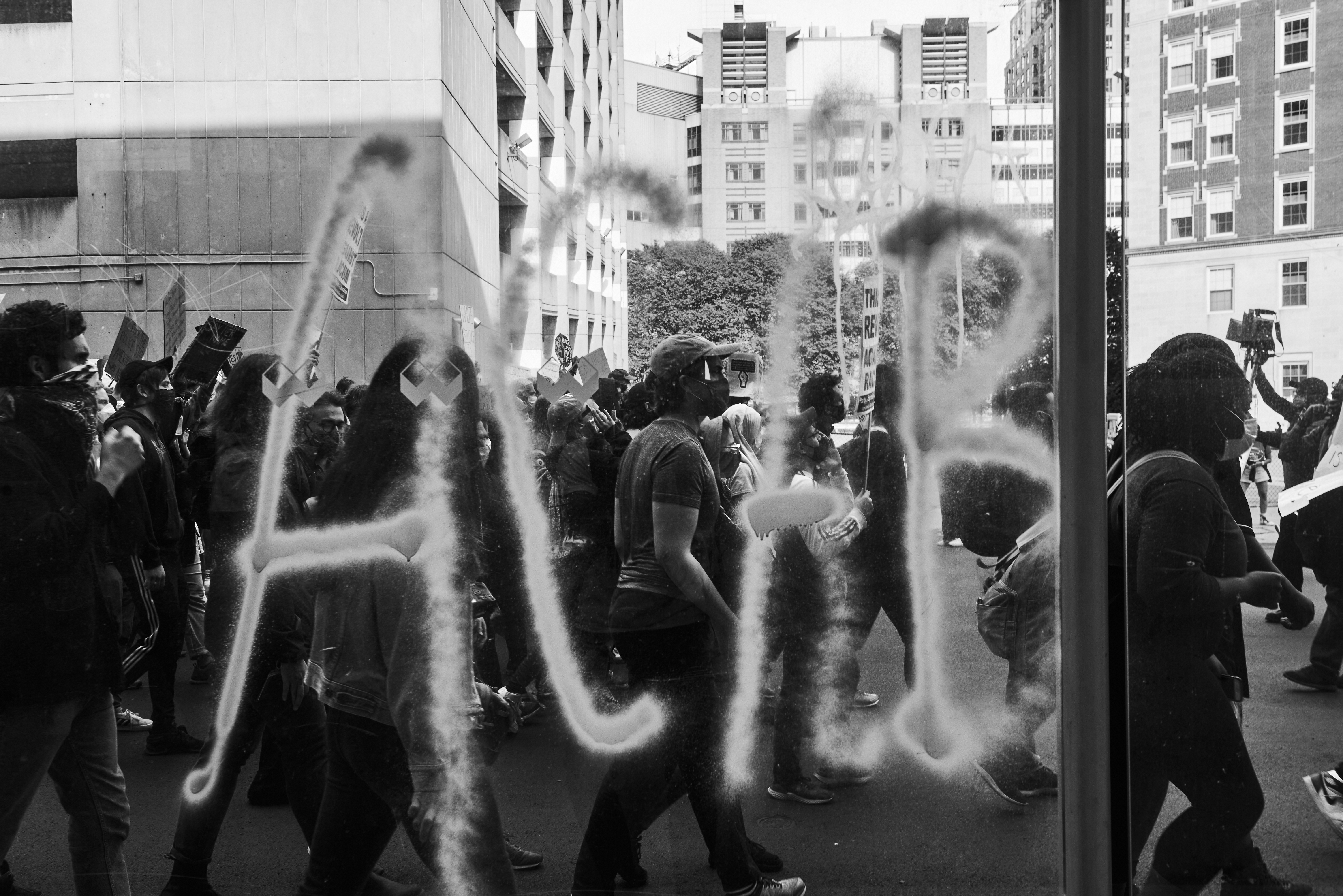 Philip Keith's photograph of protesters marching along Tremont Street in Boston's South End behind a vandalized bus stop on June 7 in one of many recent demonstrations after the killing of George Floyd.