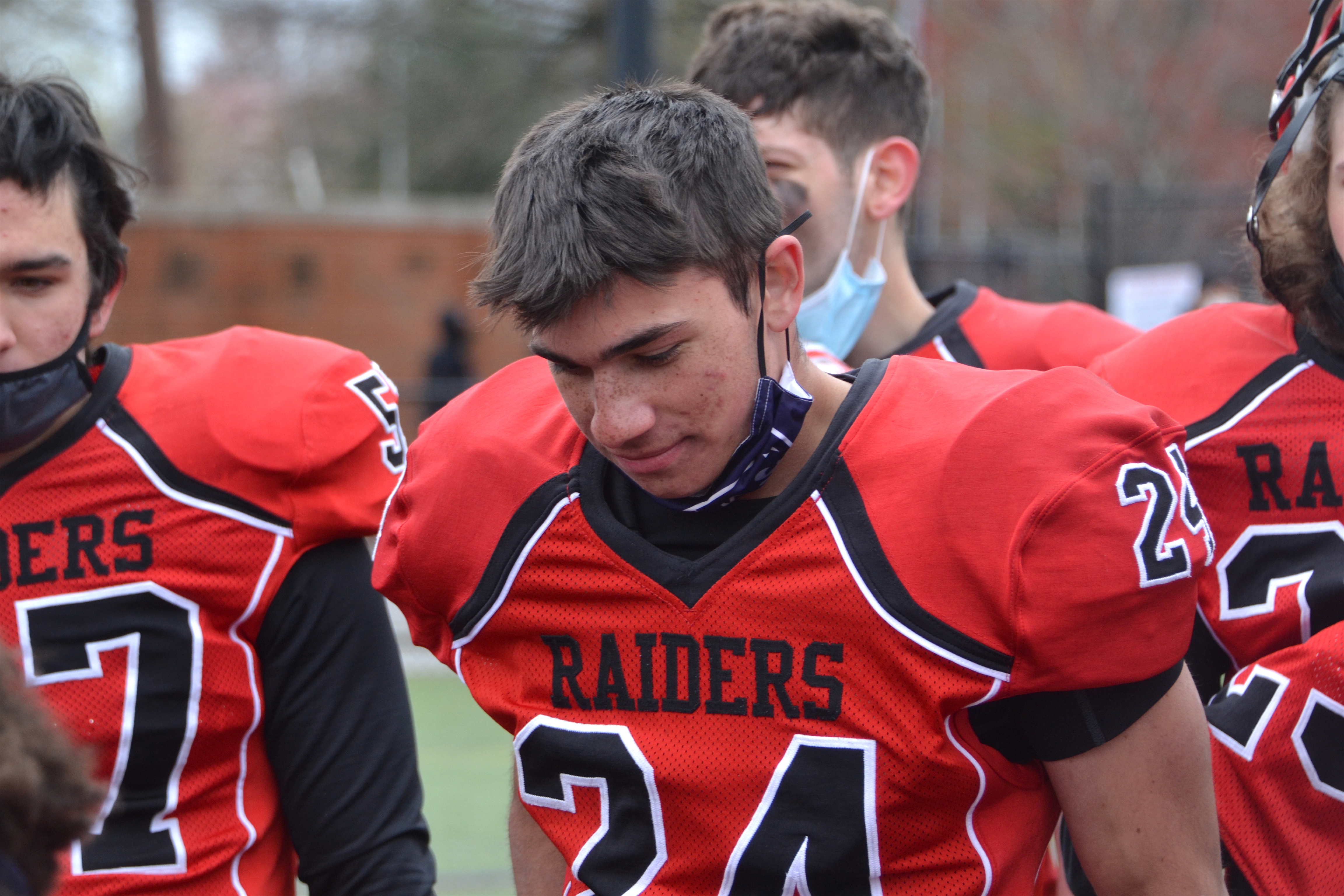 Watertown's JP Riley soaked in his three-touchdown performance while listening to the Raider coaches in the postgame gathering Saturday.