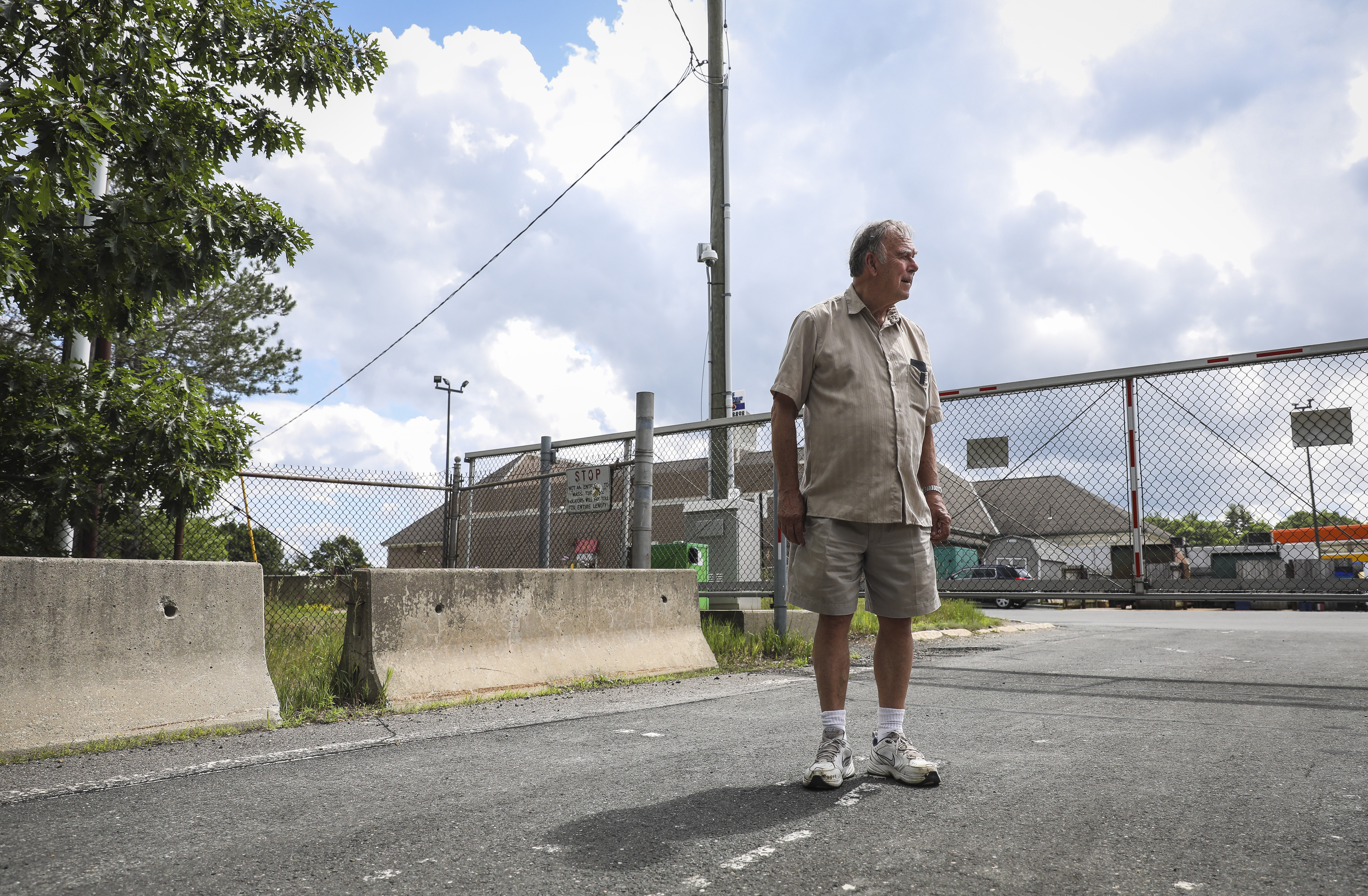 Russell resident Bruce Anderson stood near where an eastbound ramp was proposed that would allow nearby community members easier access to their home.