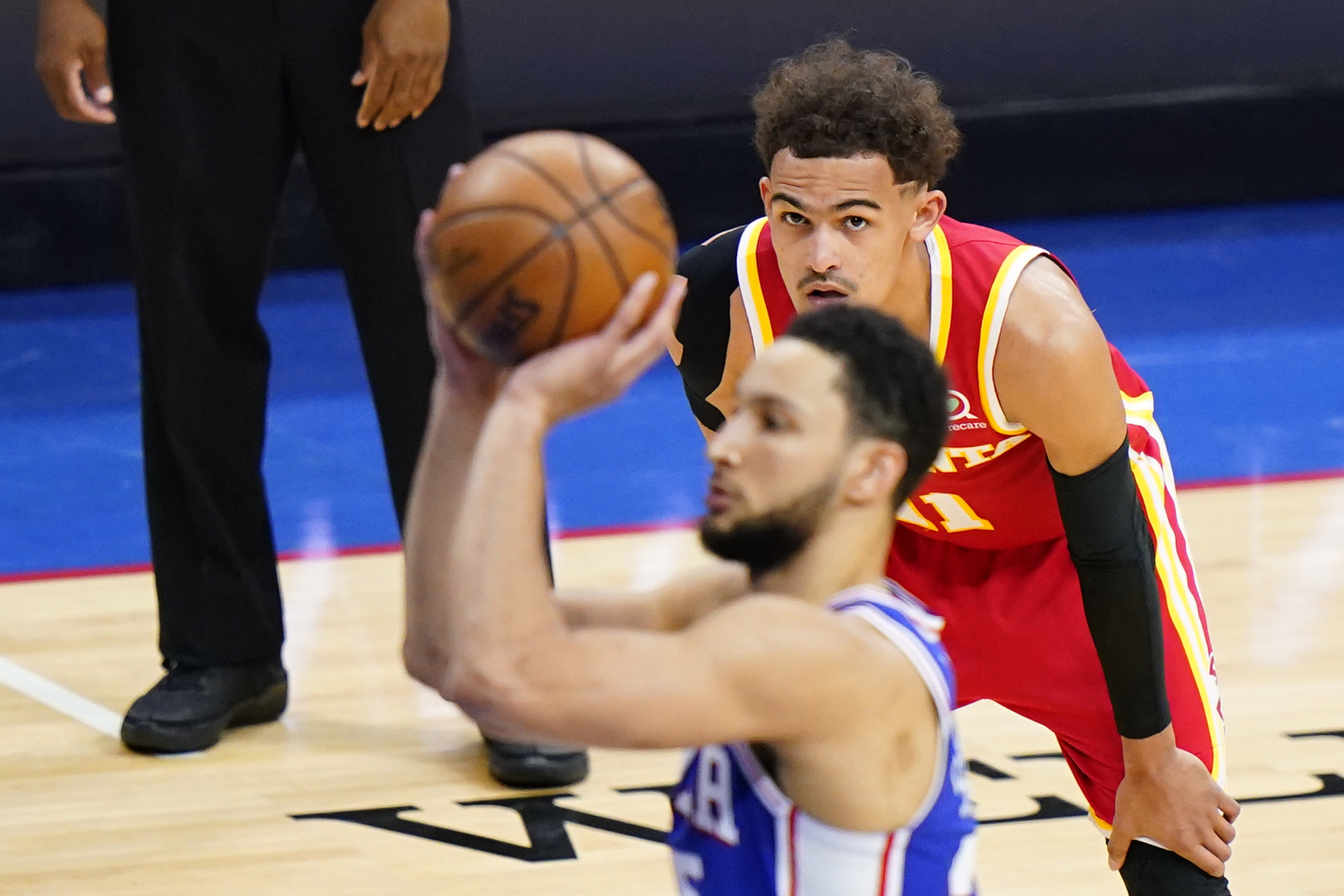 Atlanta's Trae Young watches as Philadelphia's Ben Simmons struggles from the line Wednesday night. The Sixers' guard has abysmal numbers when it comes to free-throw percentage.
