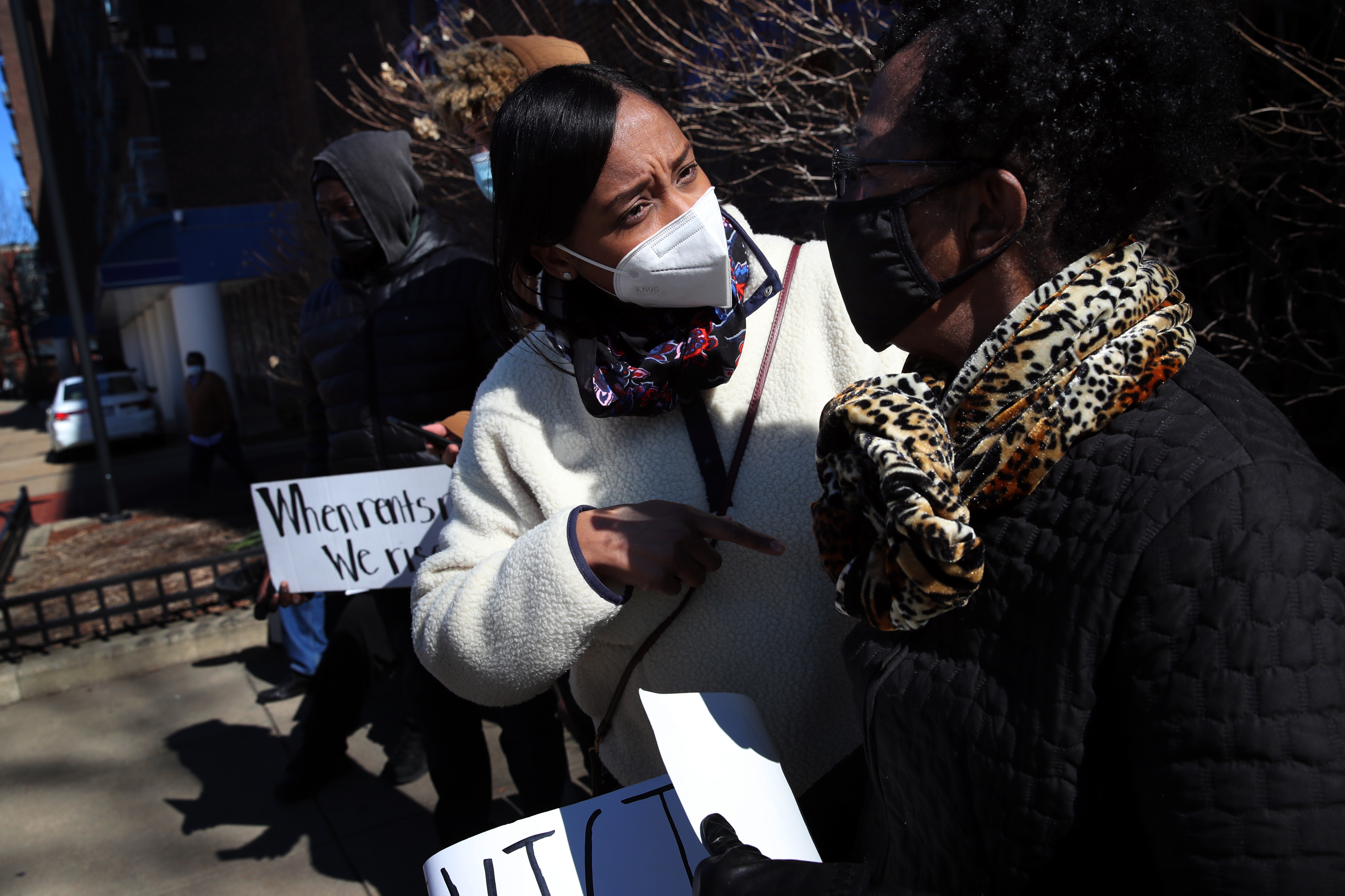 Mayoral candidate, City Councilor Andrea Campbell (left) talked with resident Kimaada Shelton (right) during a rally against a rent increase at Grant Manor in Boston.
